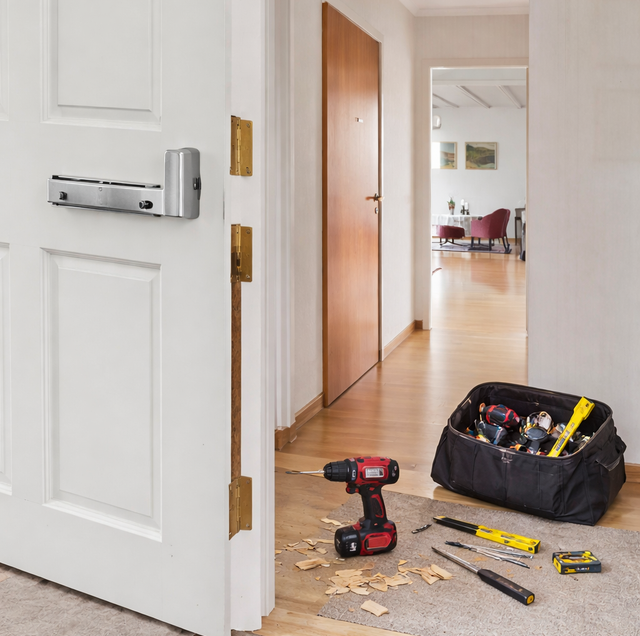 plain wooden slab door beside full pre-hung door frame