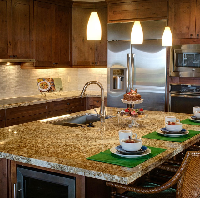 polished granite slab with quartz sample beside it