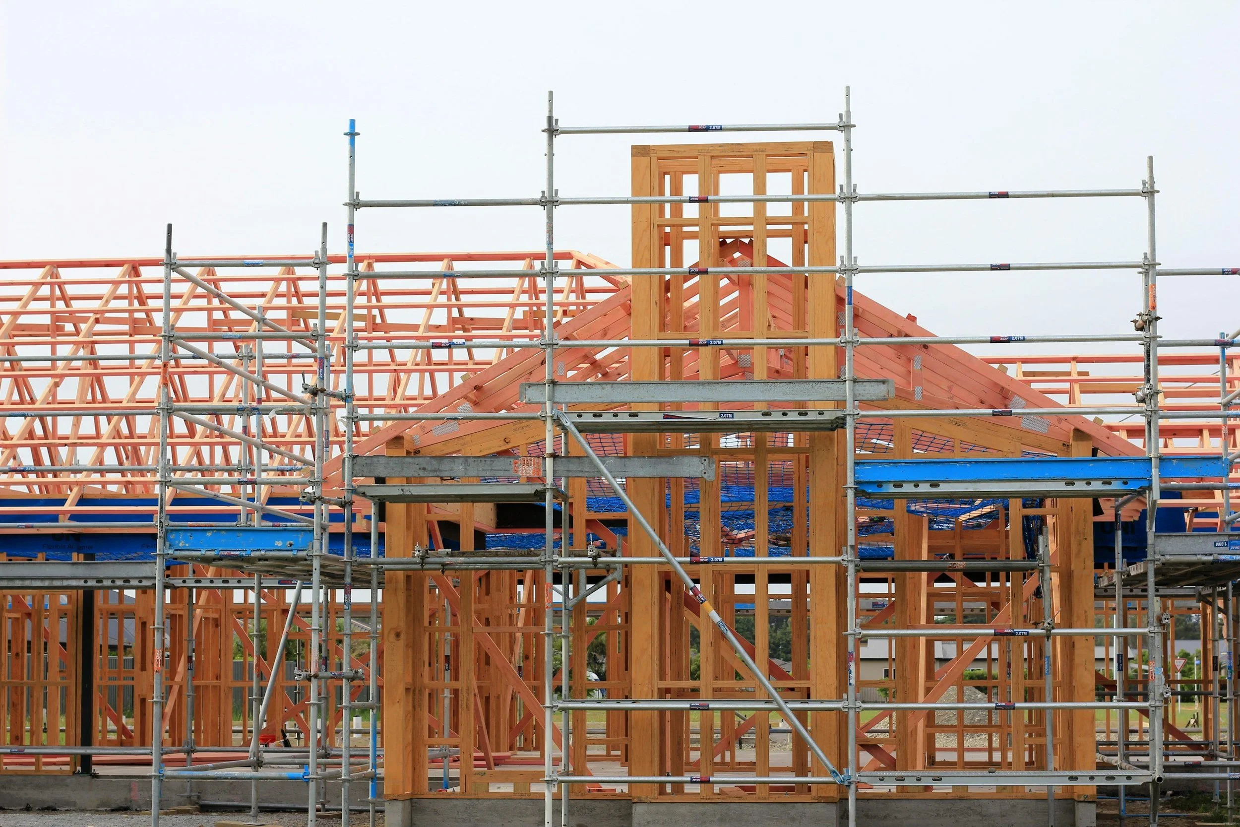 Wooden framing and scaffolding of a building under construction.