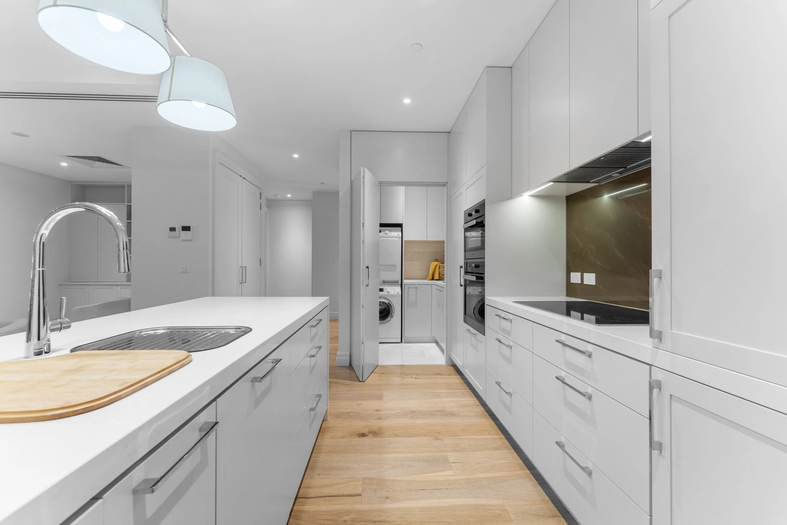 The Benson Apartment LG3 kitchen and European laundry.jpg