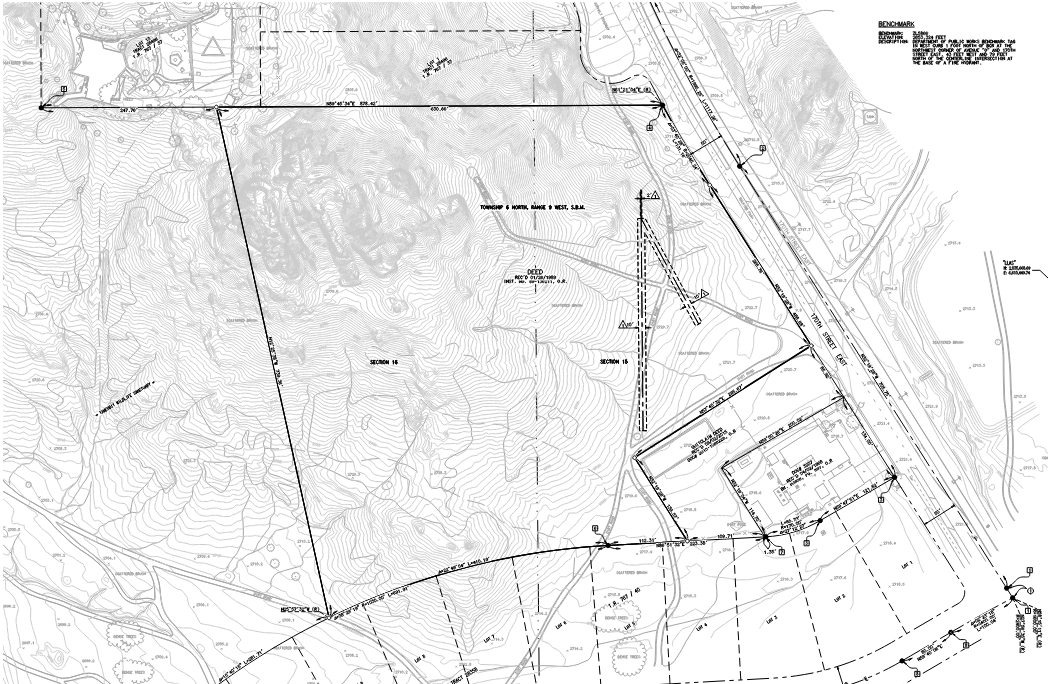 A detailed engineering or topographical survey map showing property boundaries, contour lines, measurements, and various land features.