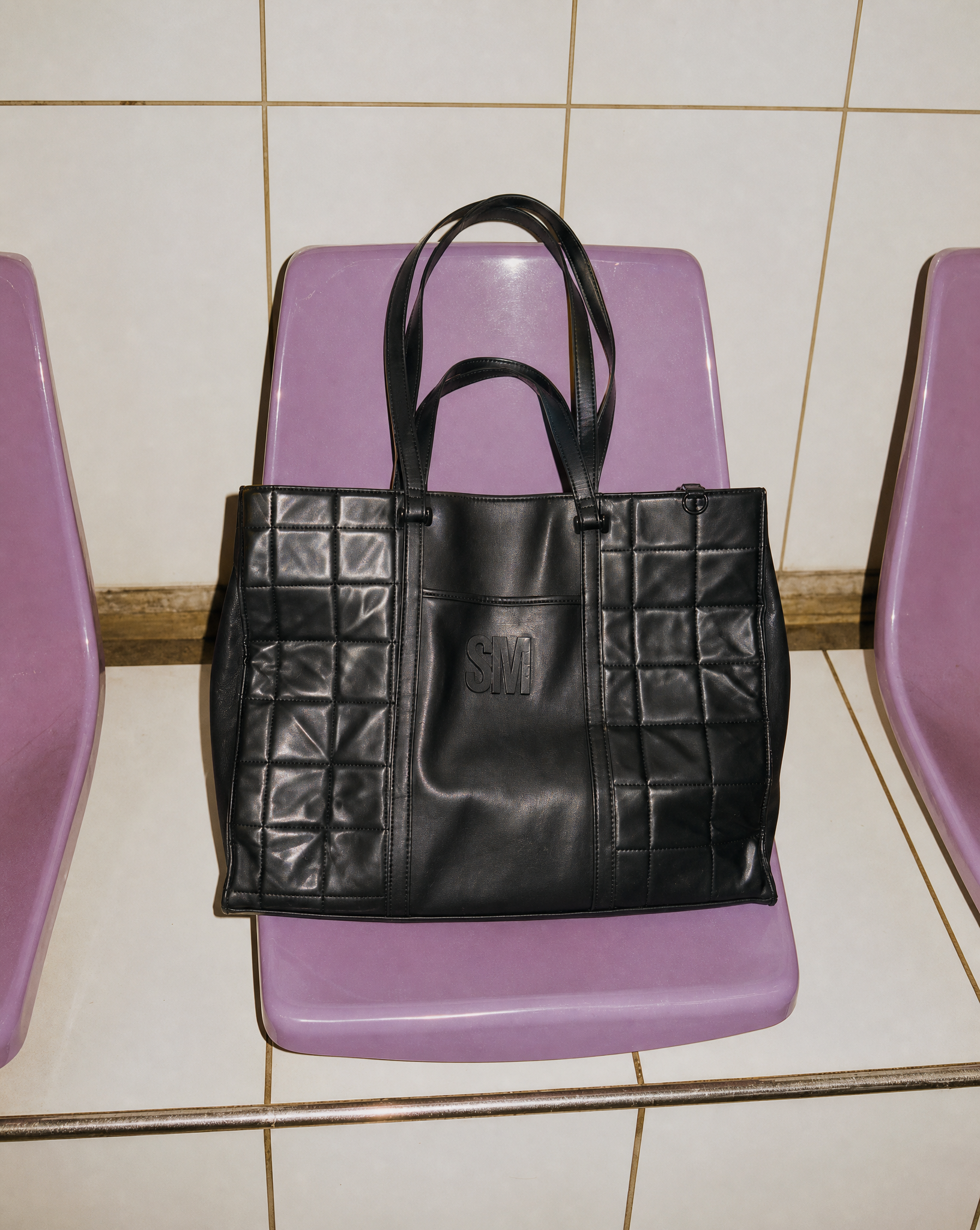 Generated with Kive.ai - Black quilted tote.png