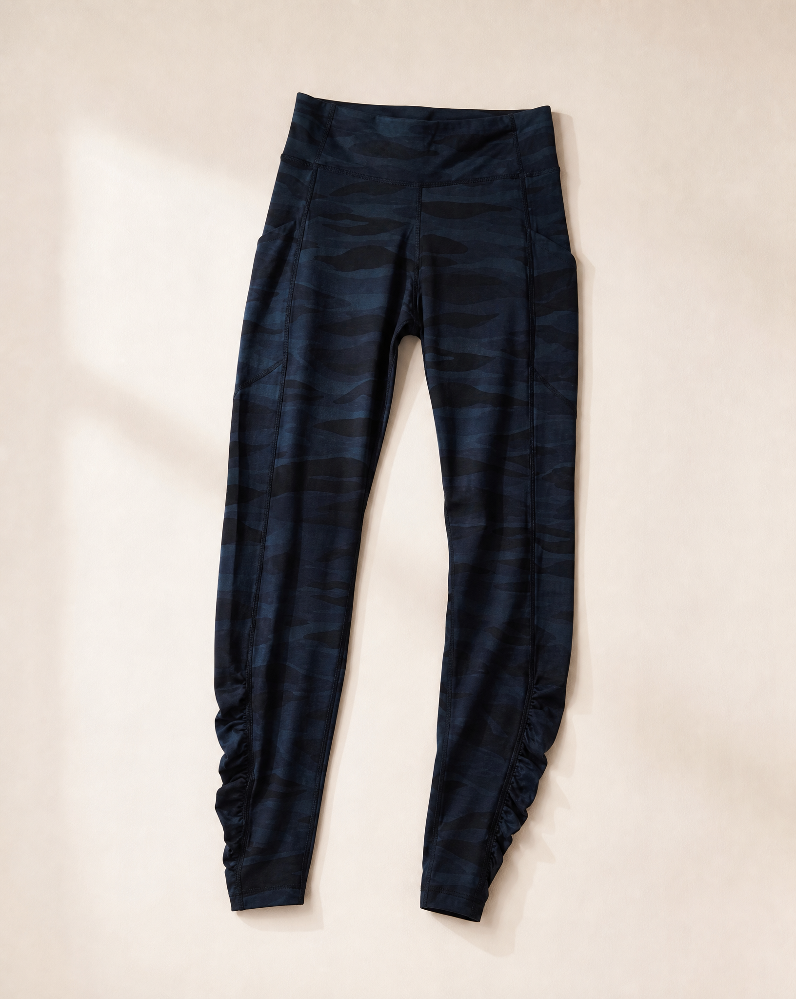 Generated with Kive.ai - Camo athletic leggings Make image 1 kind of flat lay.png