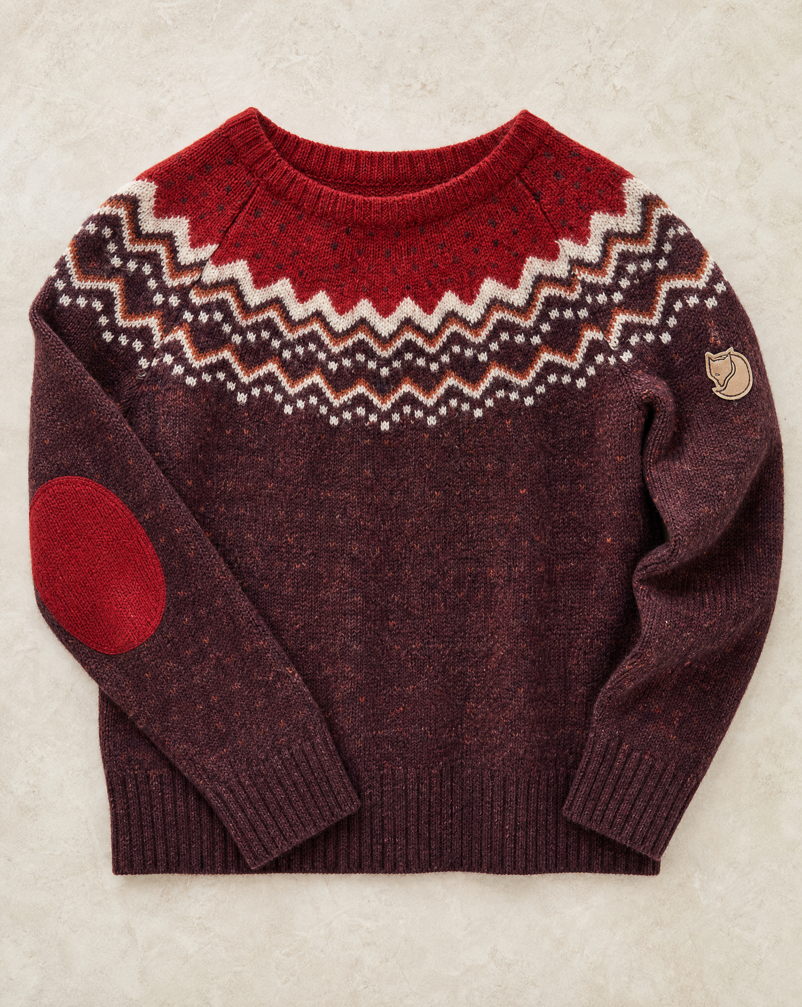 Generated with Kive.ai - Knit patterned sweater Patterned wool sweater The little fox detail is on the upper sleeve. make a flat lay where you can see it.png