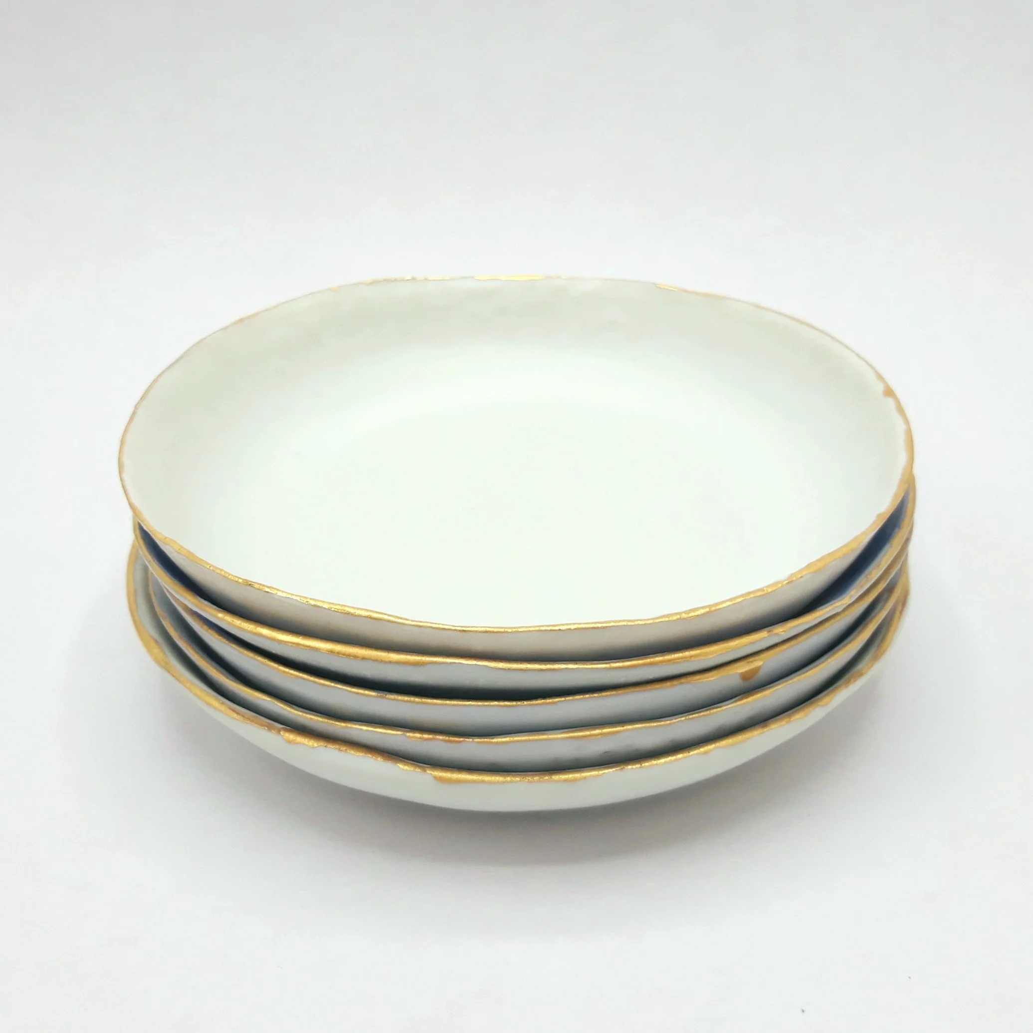 Coupelle-porcelaine-or-pile.jpg