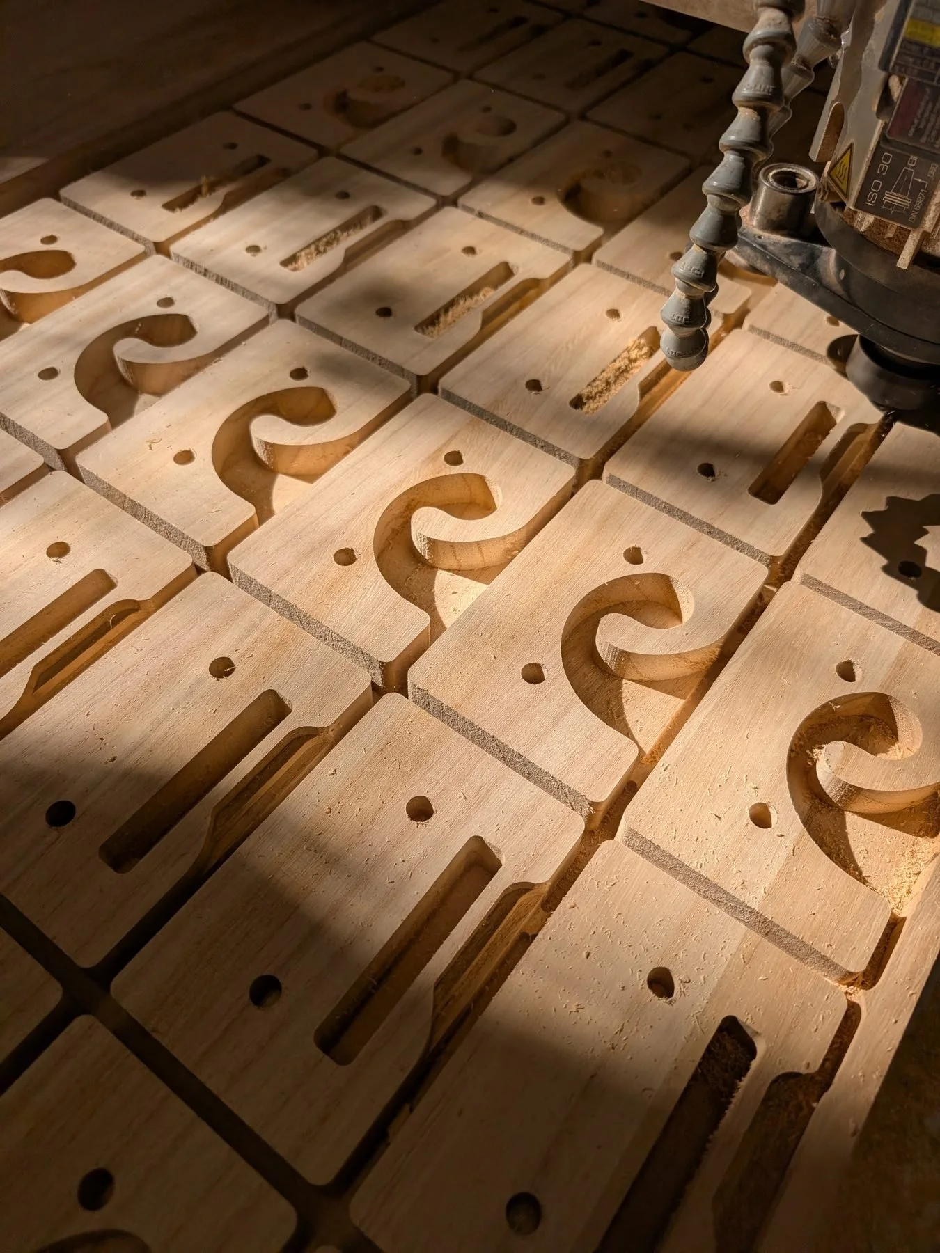 CNC-machined parts cut from a Paulownia panel