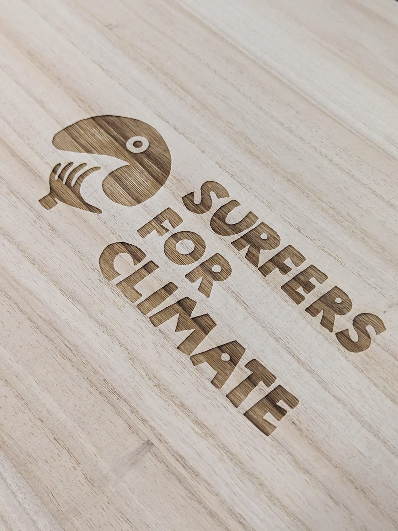 Laser-engraved logo on Paulownia timber