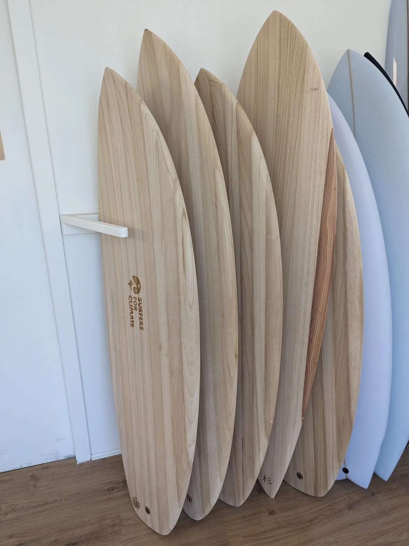 Wooden fish surfboards shaped from Paulownia