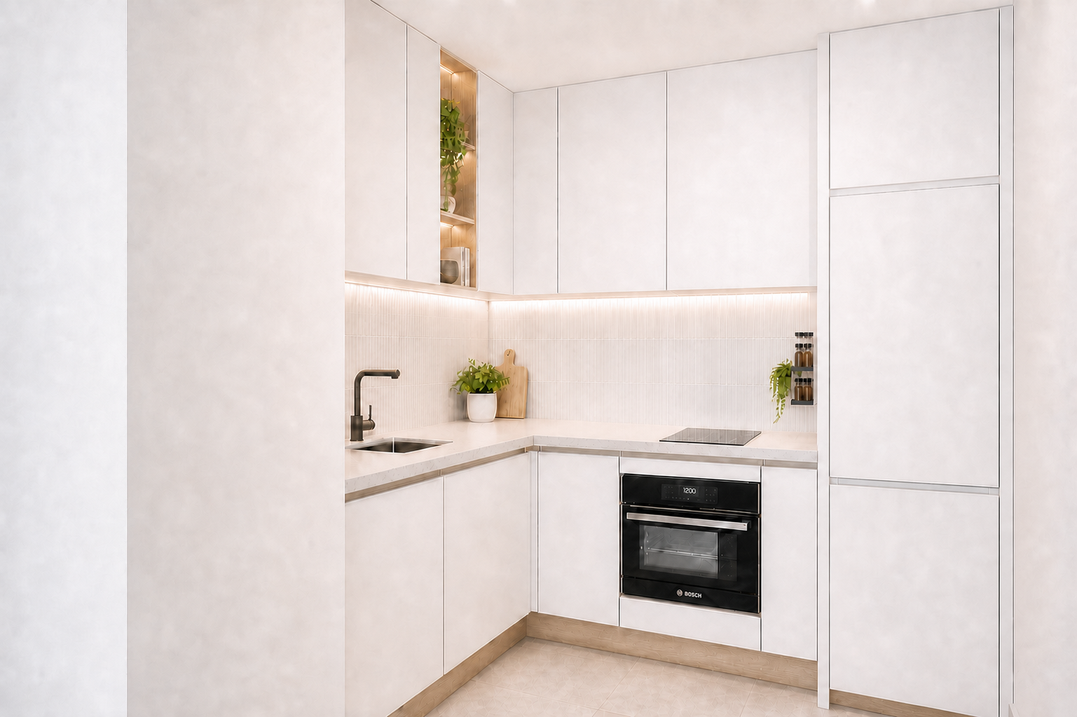 Minimalist white kitchen with built-in appliances, black oven, white cabinetry, small black spice rack, potted plants, and wooden cutting board.