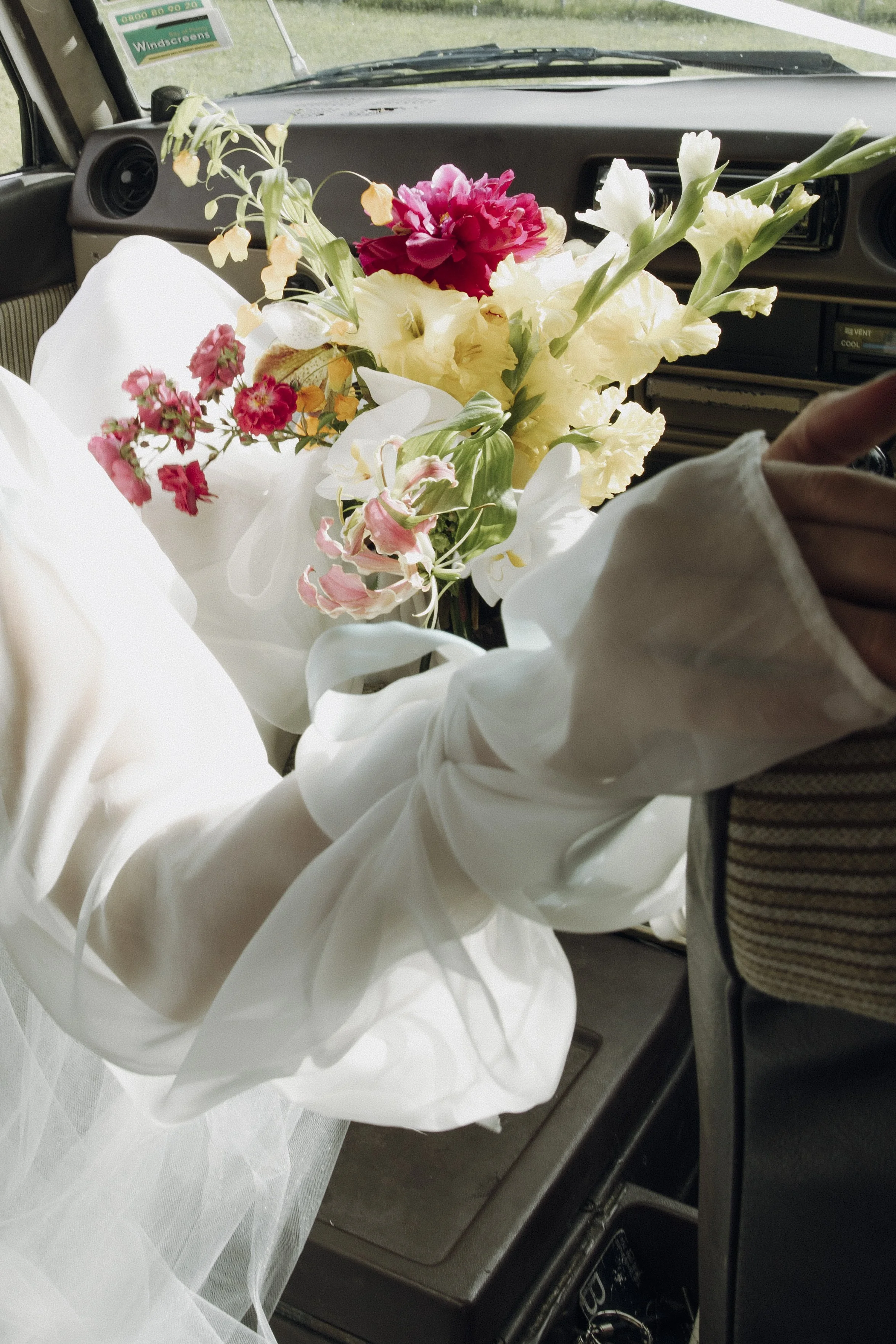 Whimsical bouquet with gladioli, gloriosa