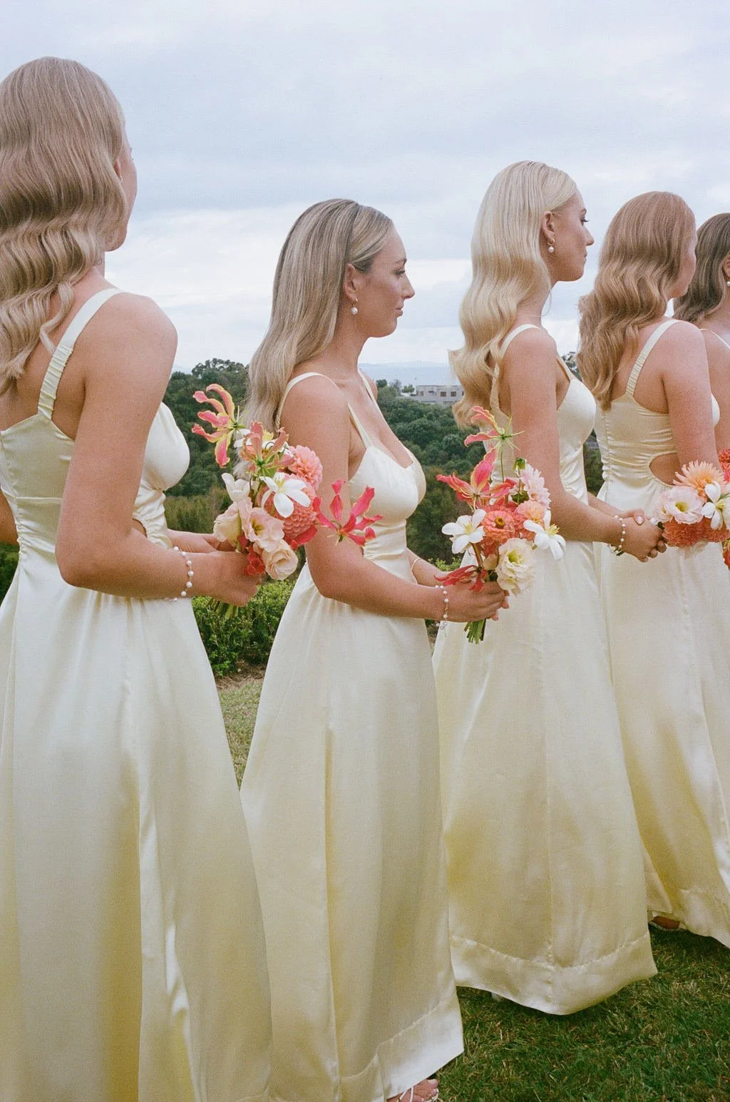 Delicate bridesmaid posies in gloriosa, dahlias and lisianthus 
