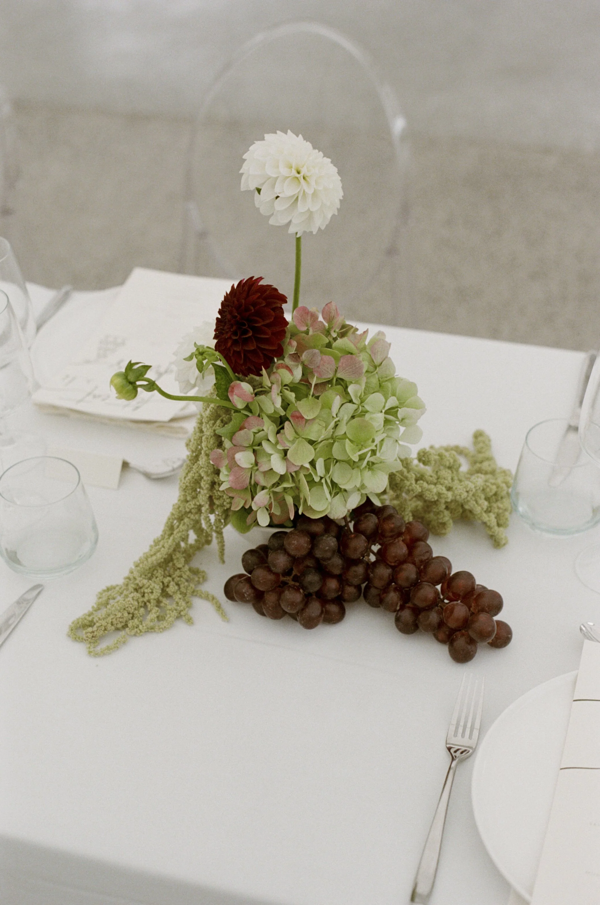 Hydrangea and grapes on tables