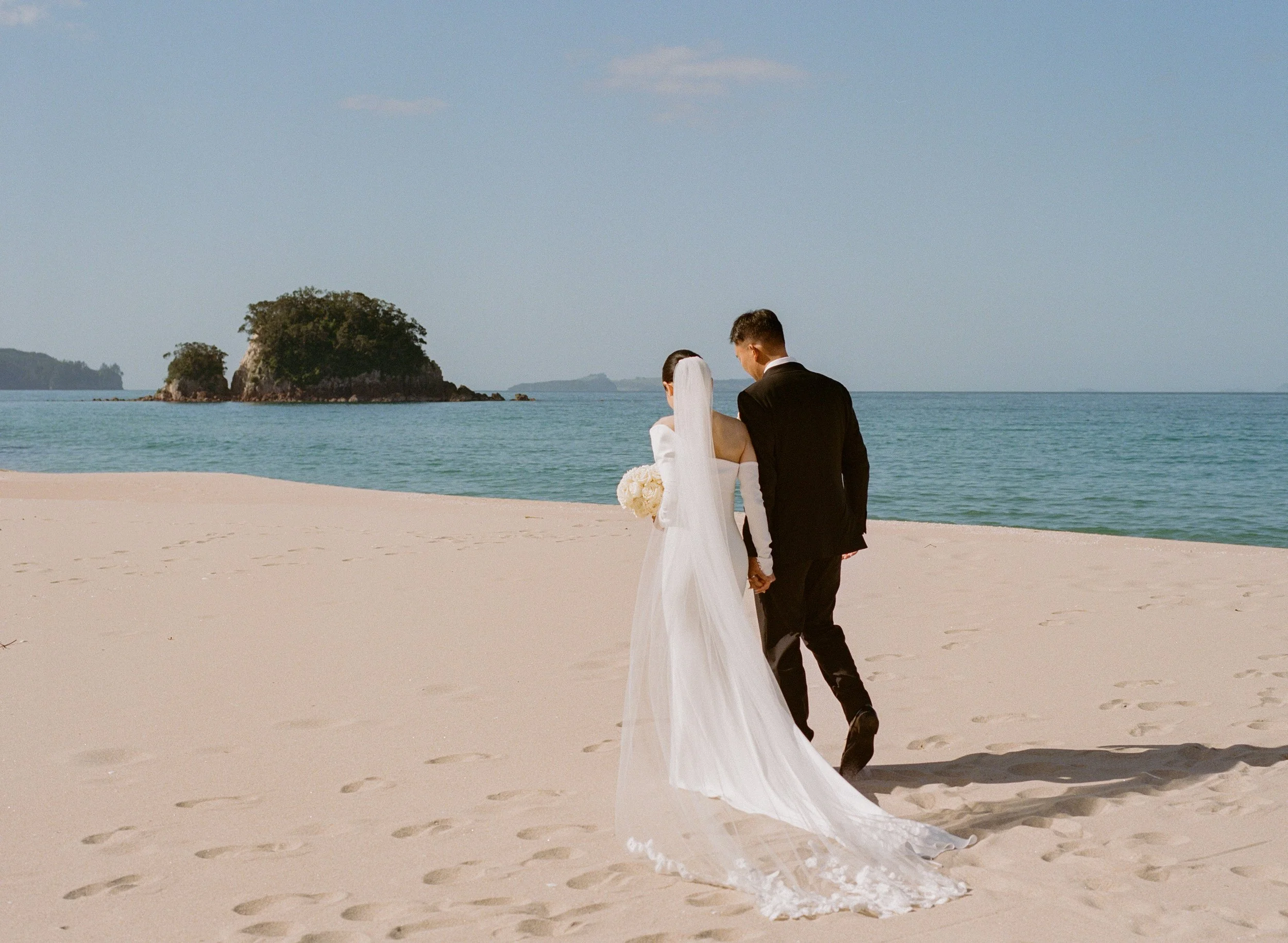 Bride and groom on beach