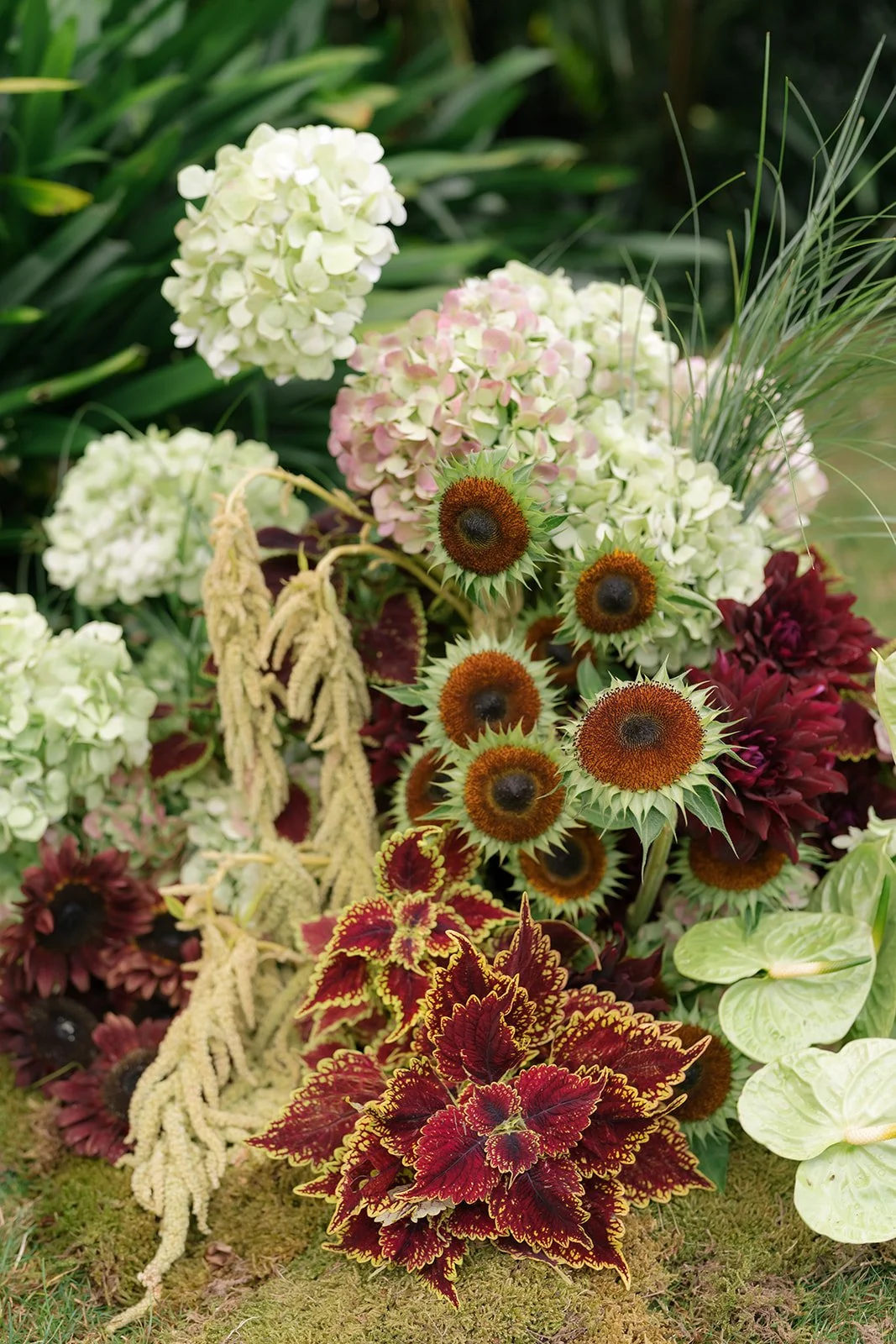 Ceremony floral garden of sunflowers, amaranthus, hydrangea, dahlias and anthuriums.