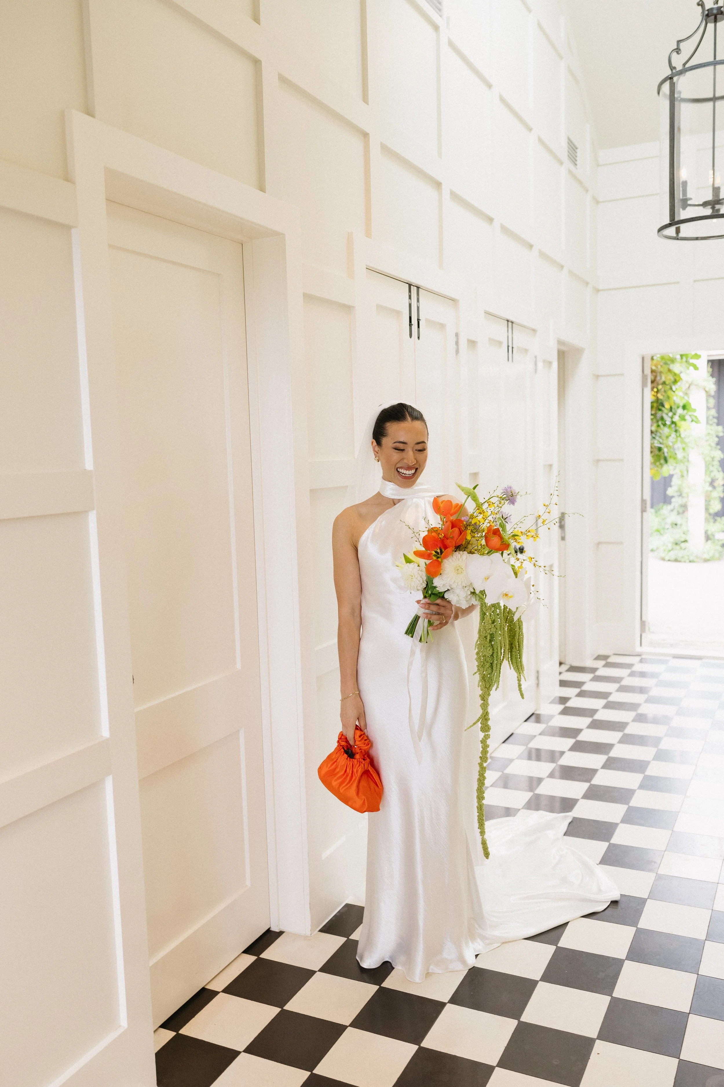 Colourful bridal bouquet with orange white and green