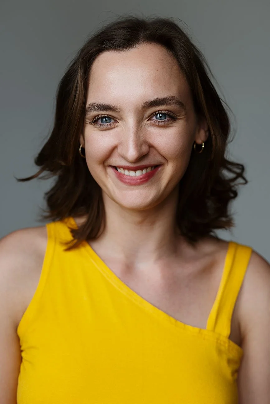 Smiling headshot taken by Chris Mann