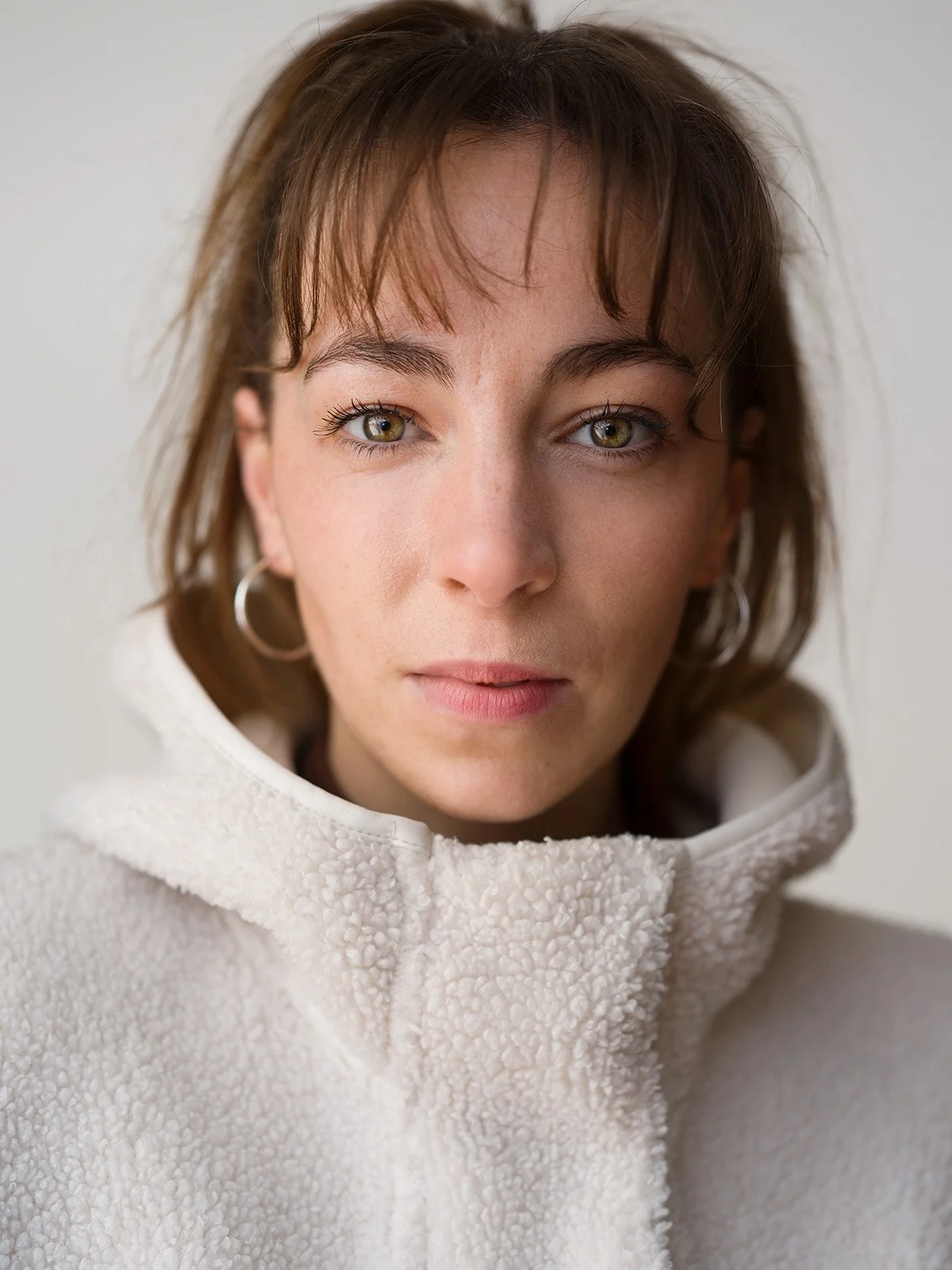 Direct headshot on plain backdrop by Chris Mann