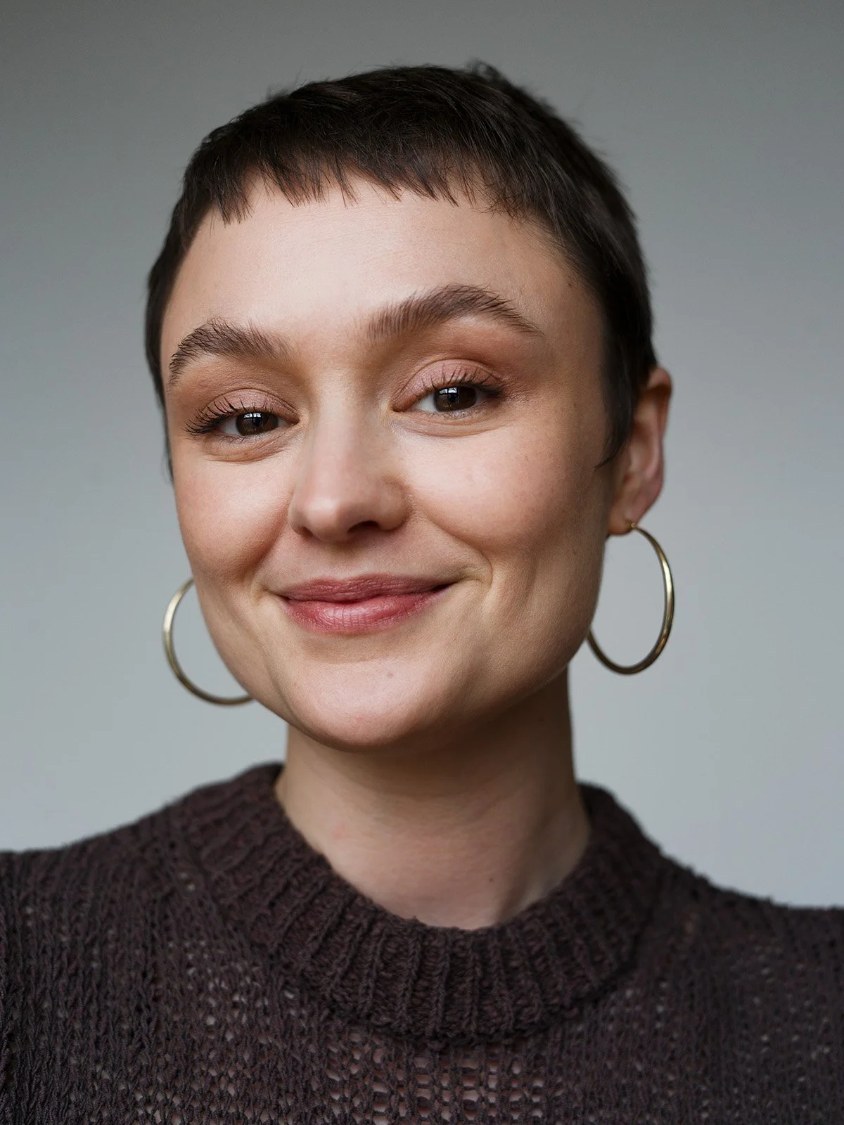 Smiling professional headshot by Chris Mann London