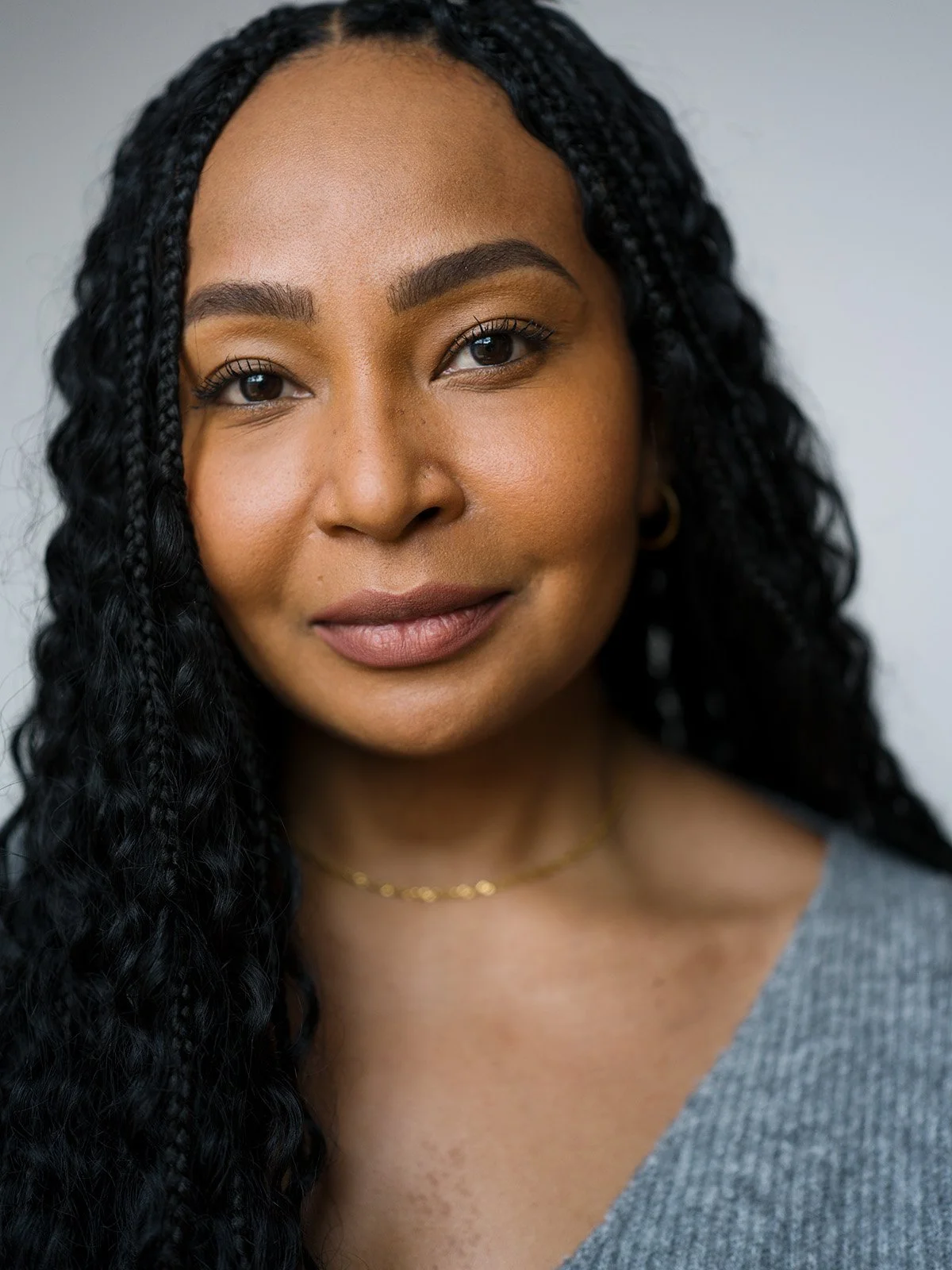 Headshot photograph by Chris Mann