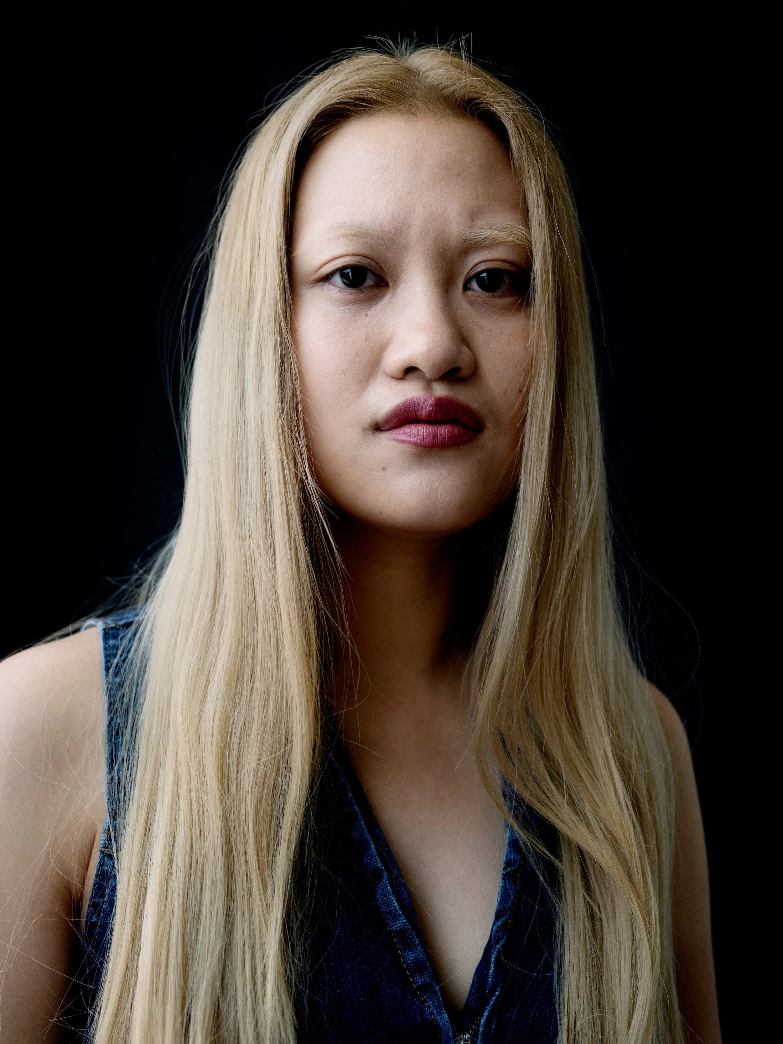 Professional headshot on dark background by Chris Mann London