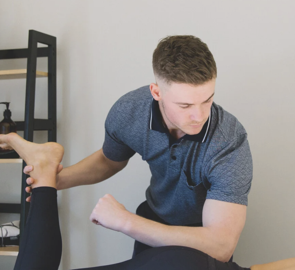 Dr Ryan Challis providing osteopathic treatment to the lower limb