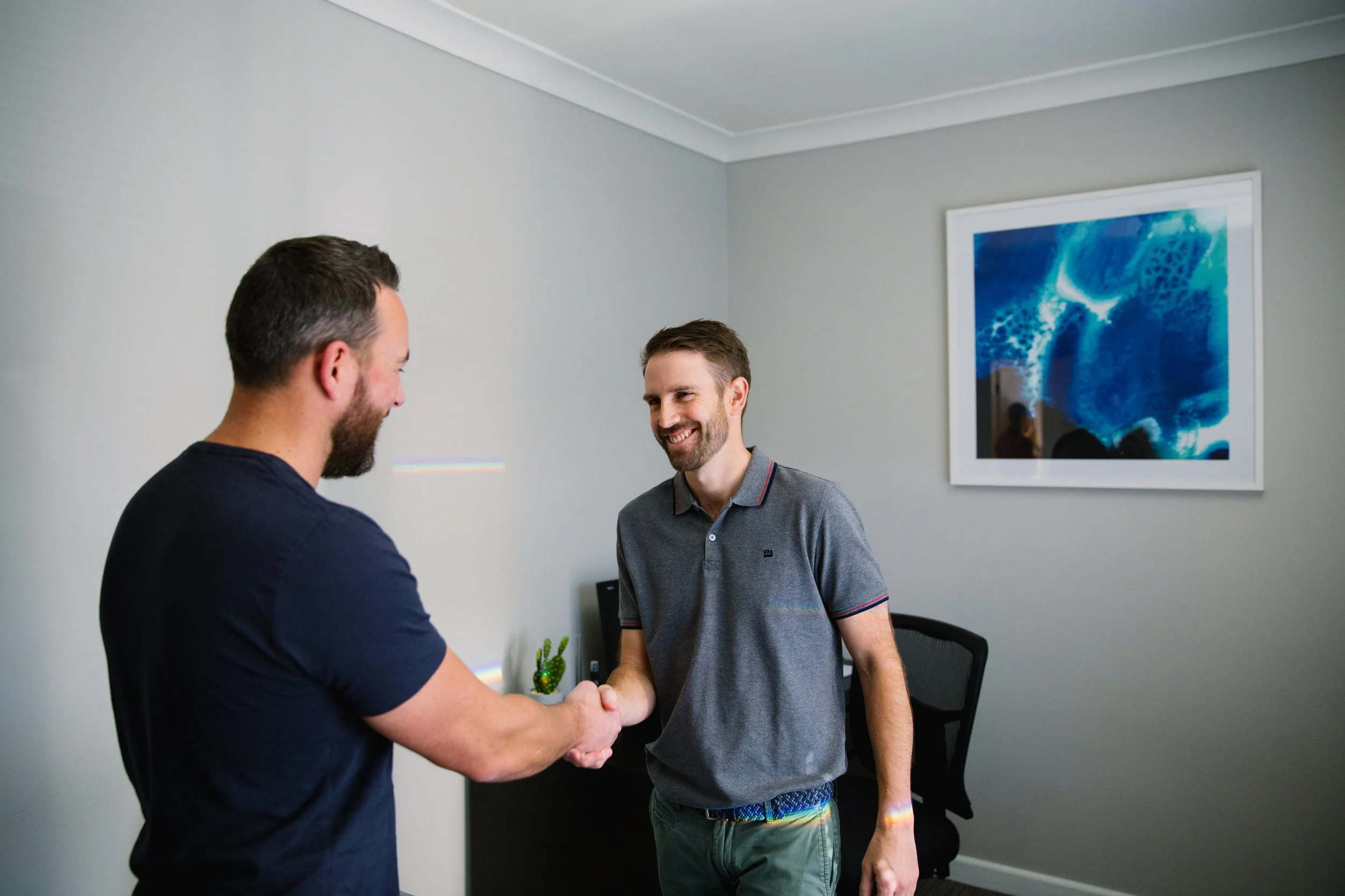 Dr Taylor Smith welcoming a patient at Osteopathic Works