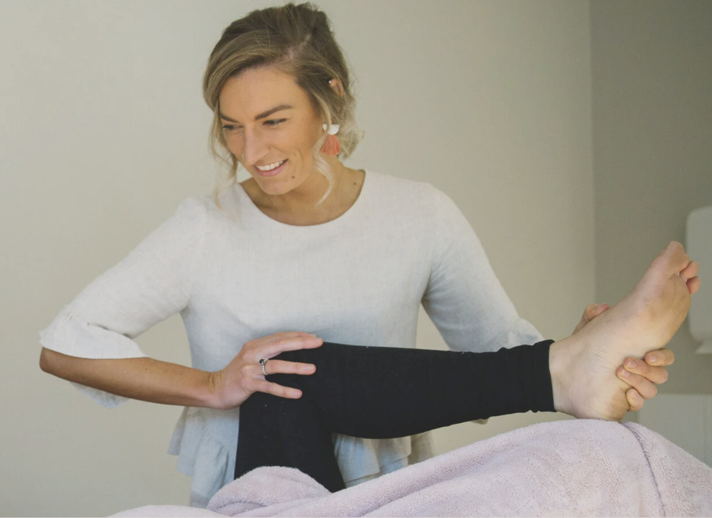 Dr Gabrielle Roney providing hands-on osteopathic treatment