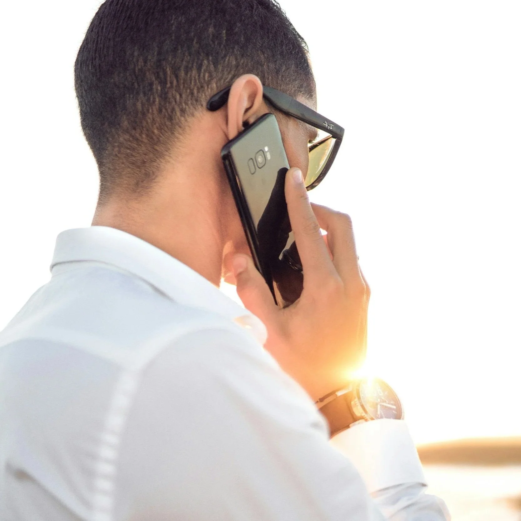 Client family talking on a cell phone with customer service