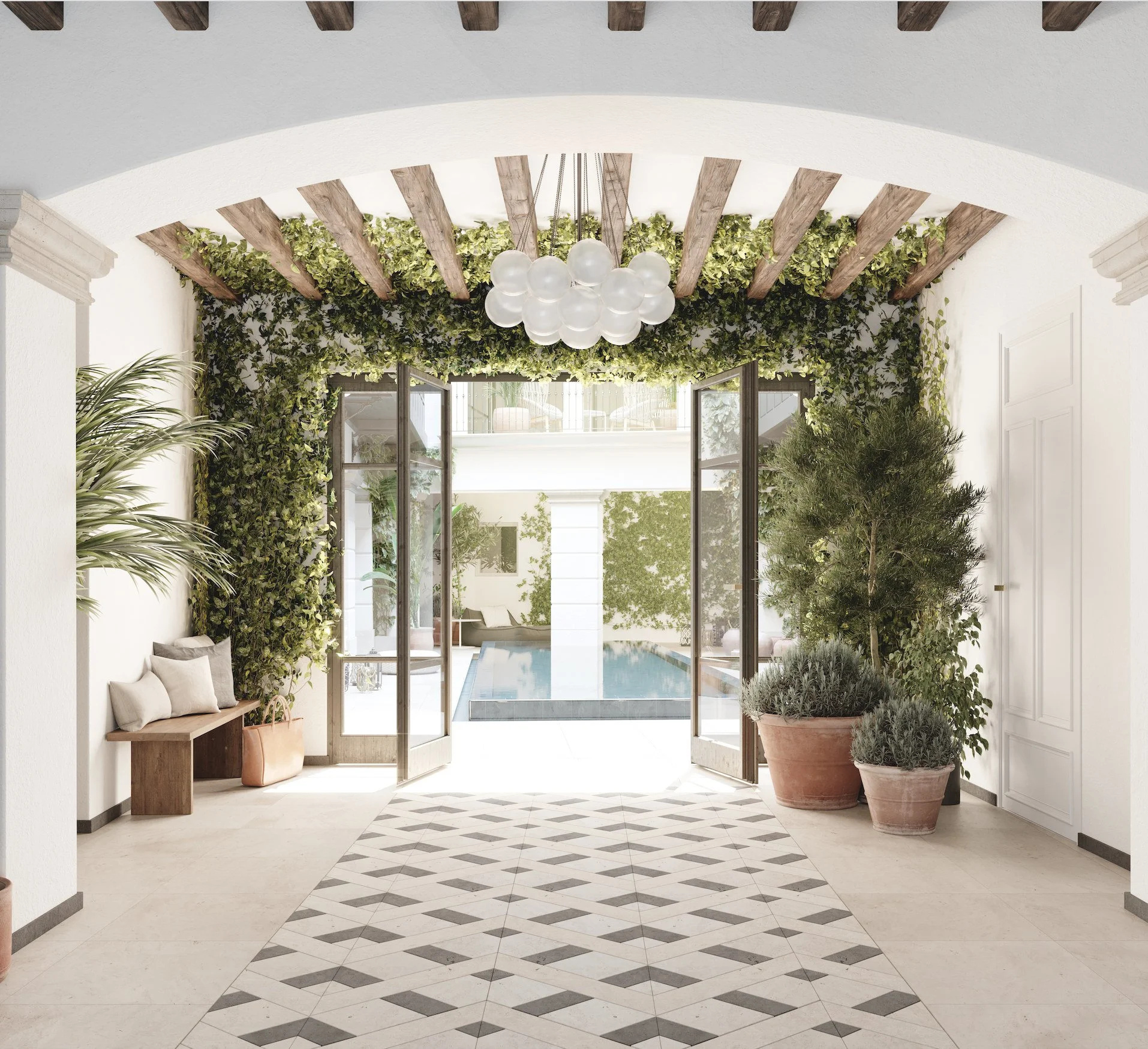 Entré med glasdörrar, gröna växter längs väggarna, bordsstolar av naturmaterial, golv med svartvita mönster, hängande lampor i glaskulor i projektet Imremta Garden i Spain