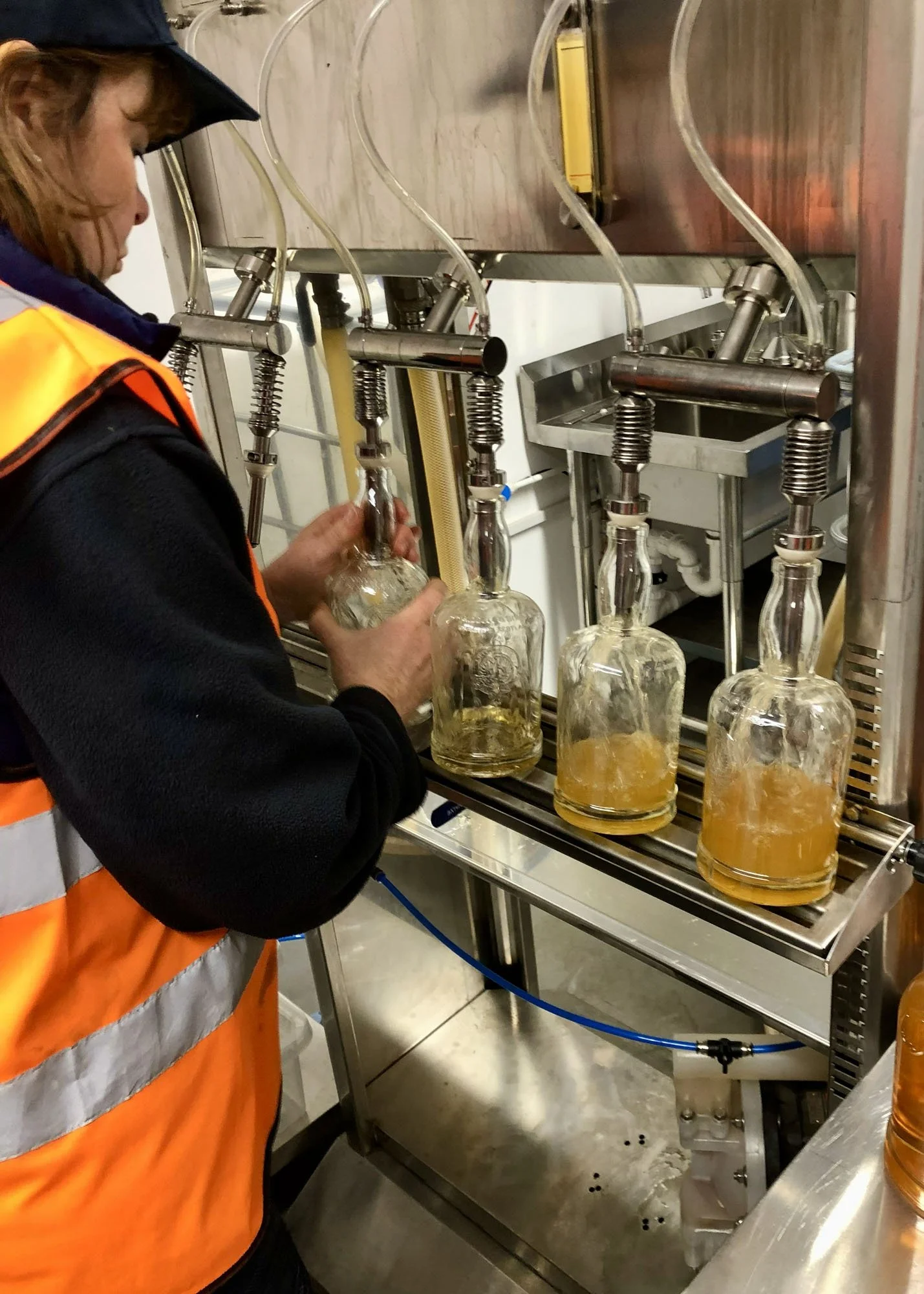 Auld Bond team member bottling whisky