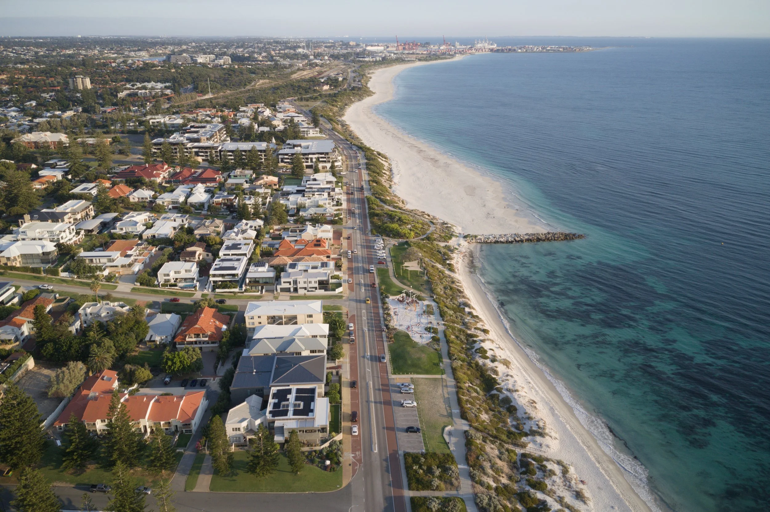 A drone shot of Cottesloe looking towards the Fremantle Port, 2025