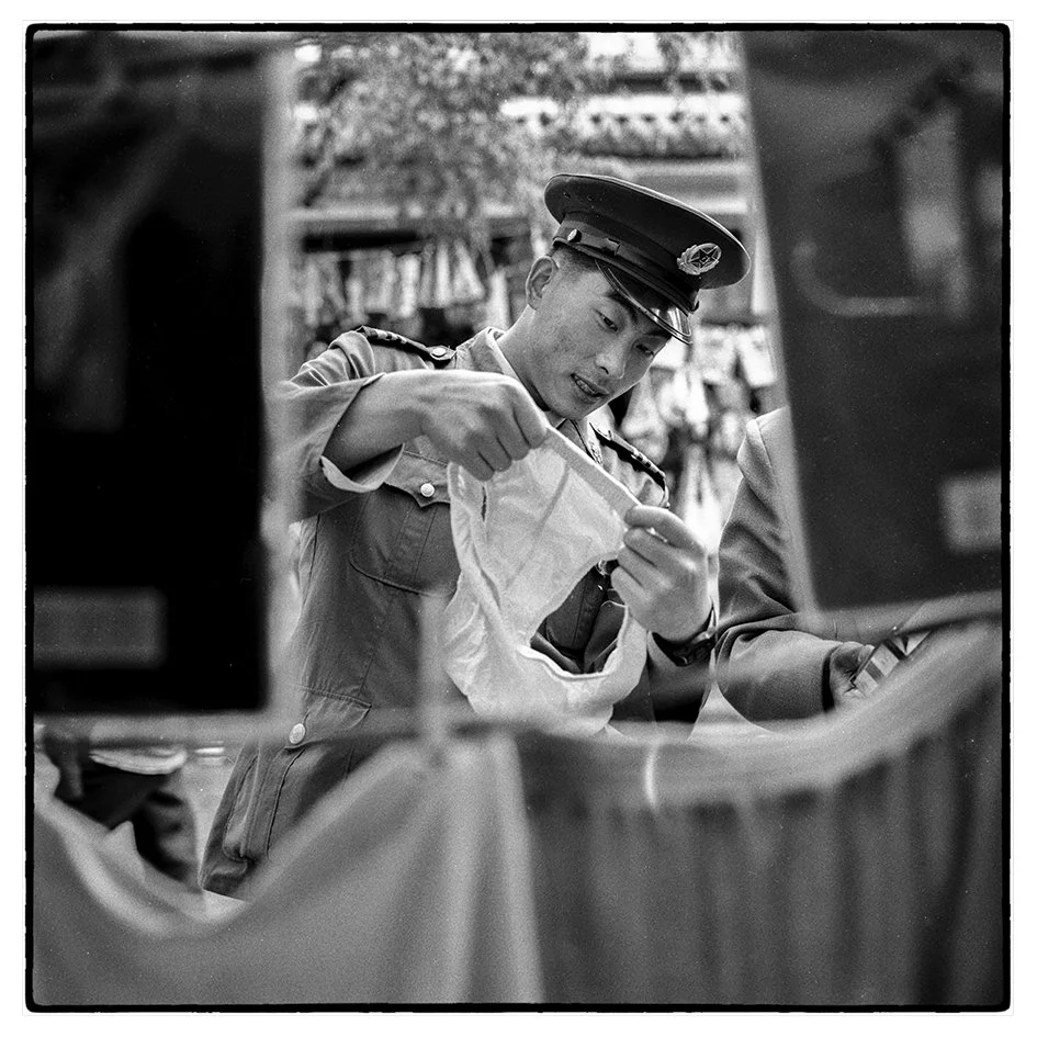 A PLA soldier inspects underwear, Dali, China 1996.