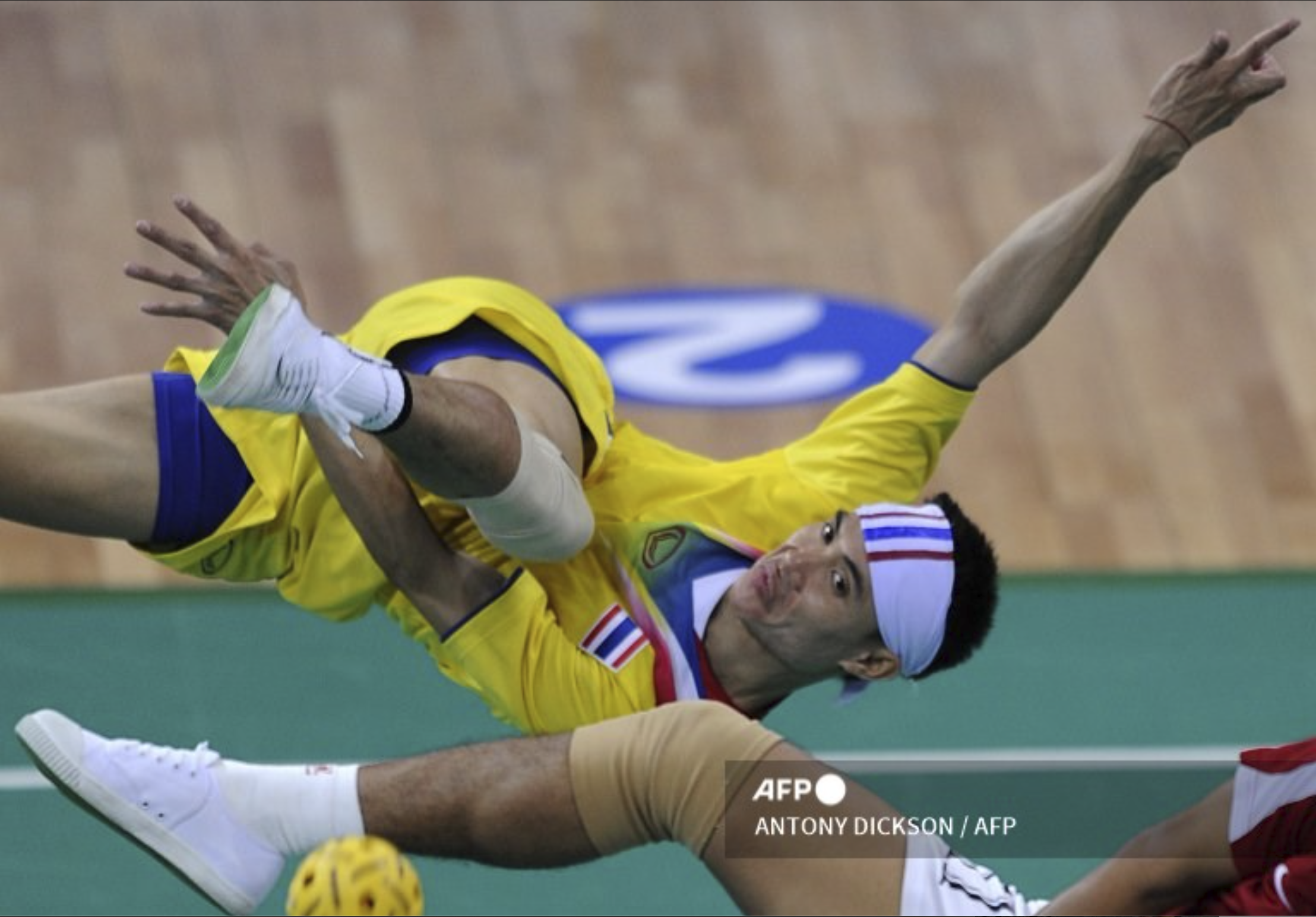Anuwat Chaichana of Thailand returns the takraw during the 16th Asian Games on November 24, 2010.  Agency France-Presse