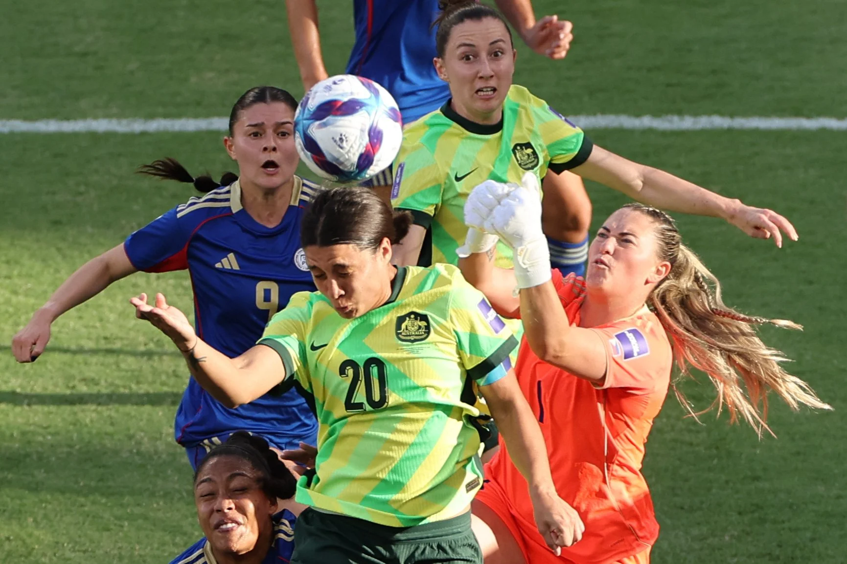 Australia’s Sam Kerr (C) heads the ball as Philippines goalkeeper Olivia McDaniel attempts to block her during the AFC Women’s Asian Cup Australia 2026 football match at Perth Stadium in Perth on March 1, 2026. Credit:  AFP / Antony DICKSON