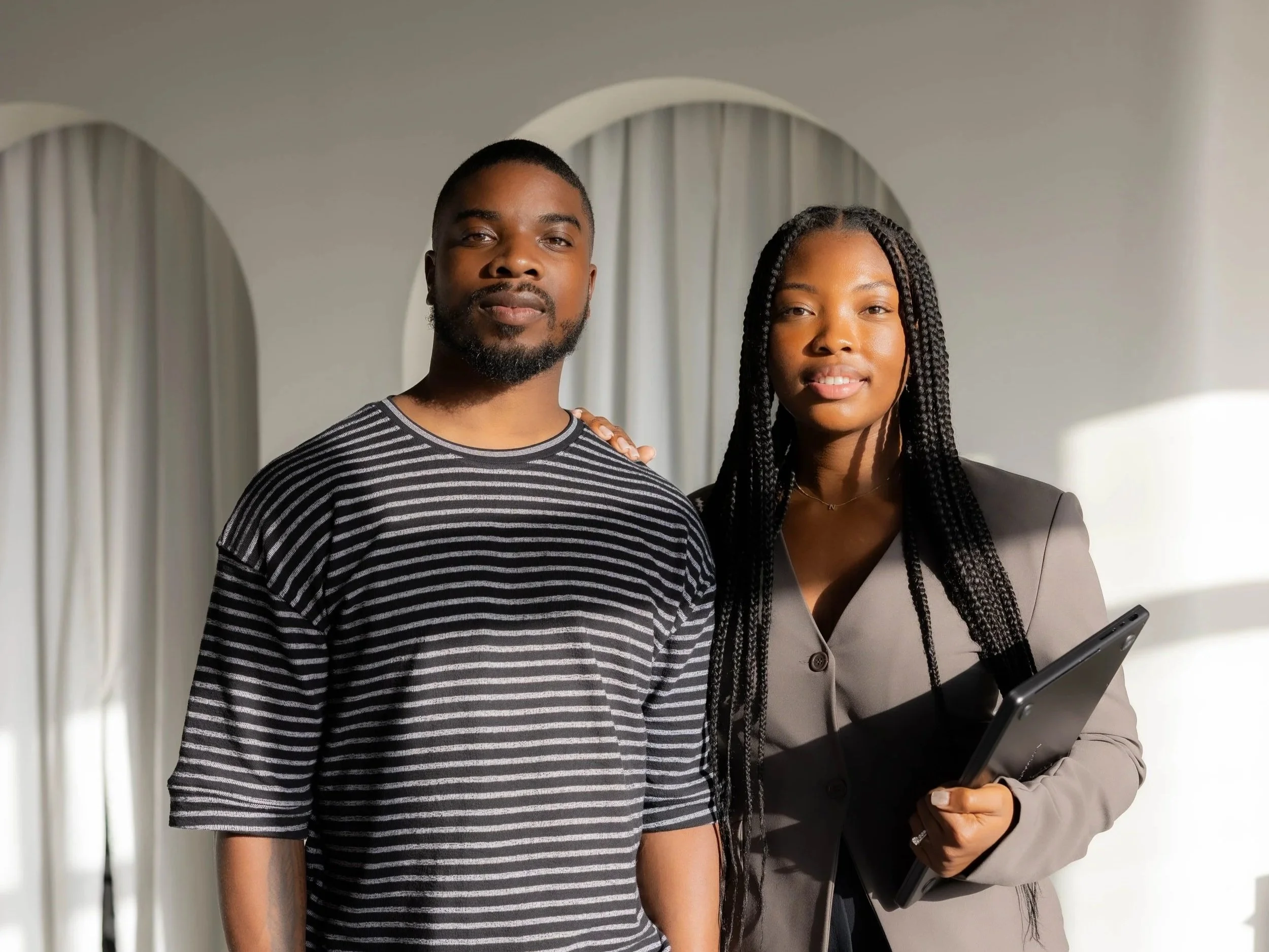 A man and a woman standing together indoors, individual trauma  and couple therapists in Fort Lauderdale, Florida.