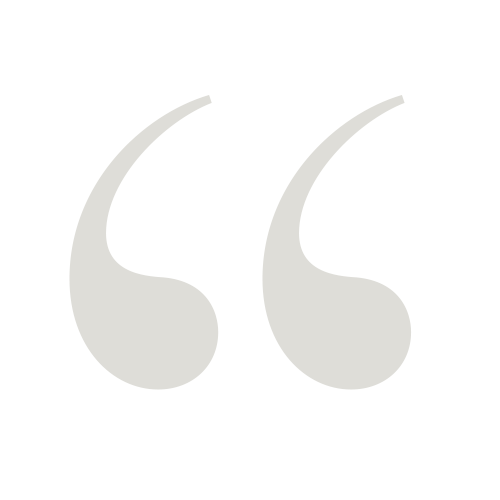 Large gray quotation marks on a black background.