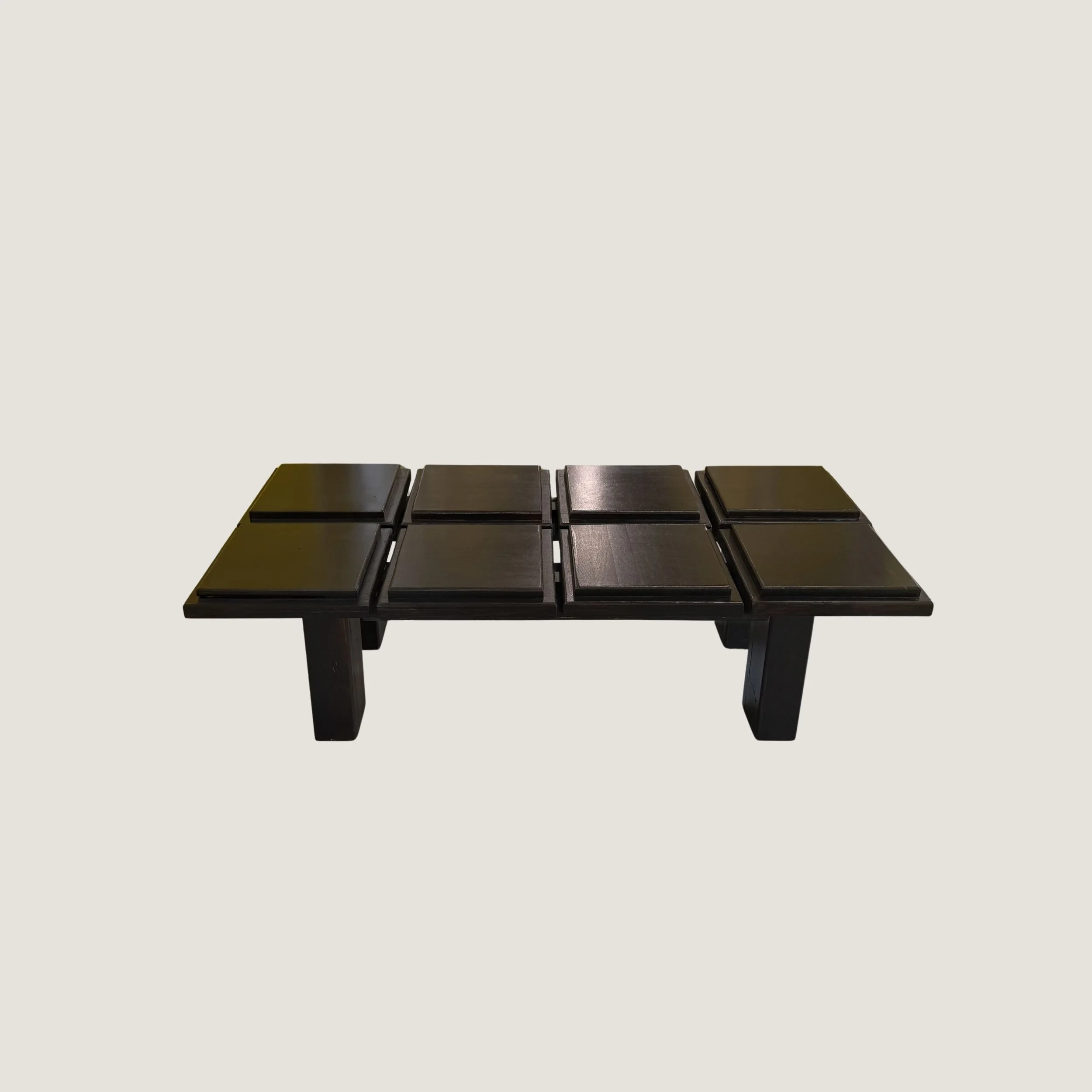 Handcrafted solid oak coffee table by KHARAD STUDIO with sculptural geometric design and black base.