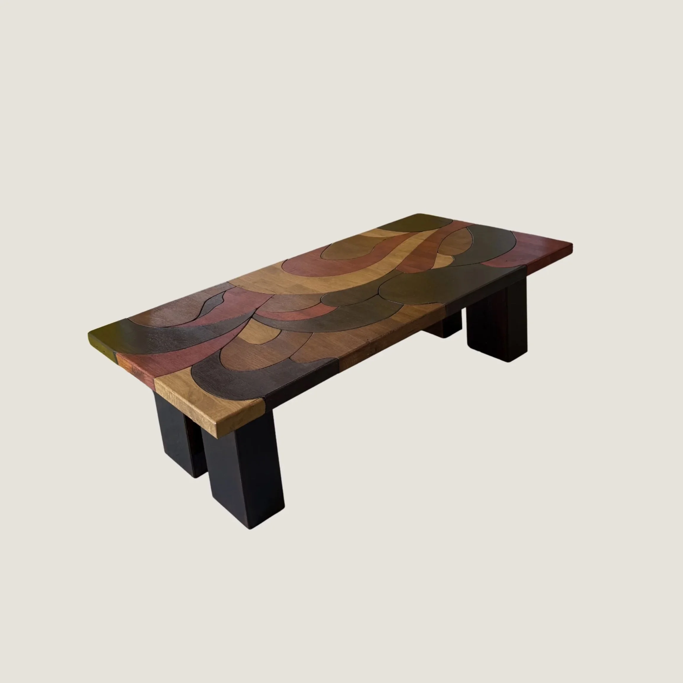Sculptural solid oak coffee table by KHARAD STUDIO featuring a colorful wave pattern.