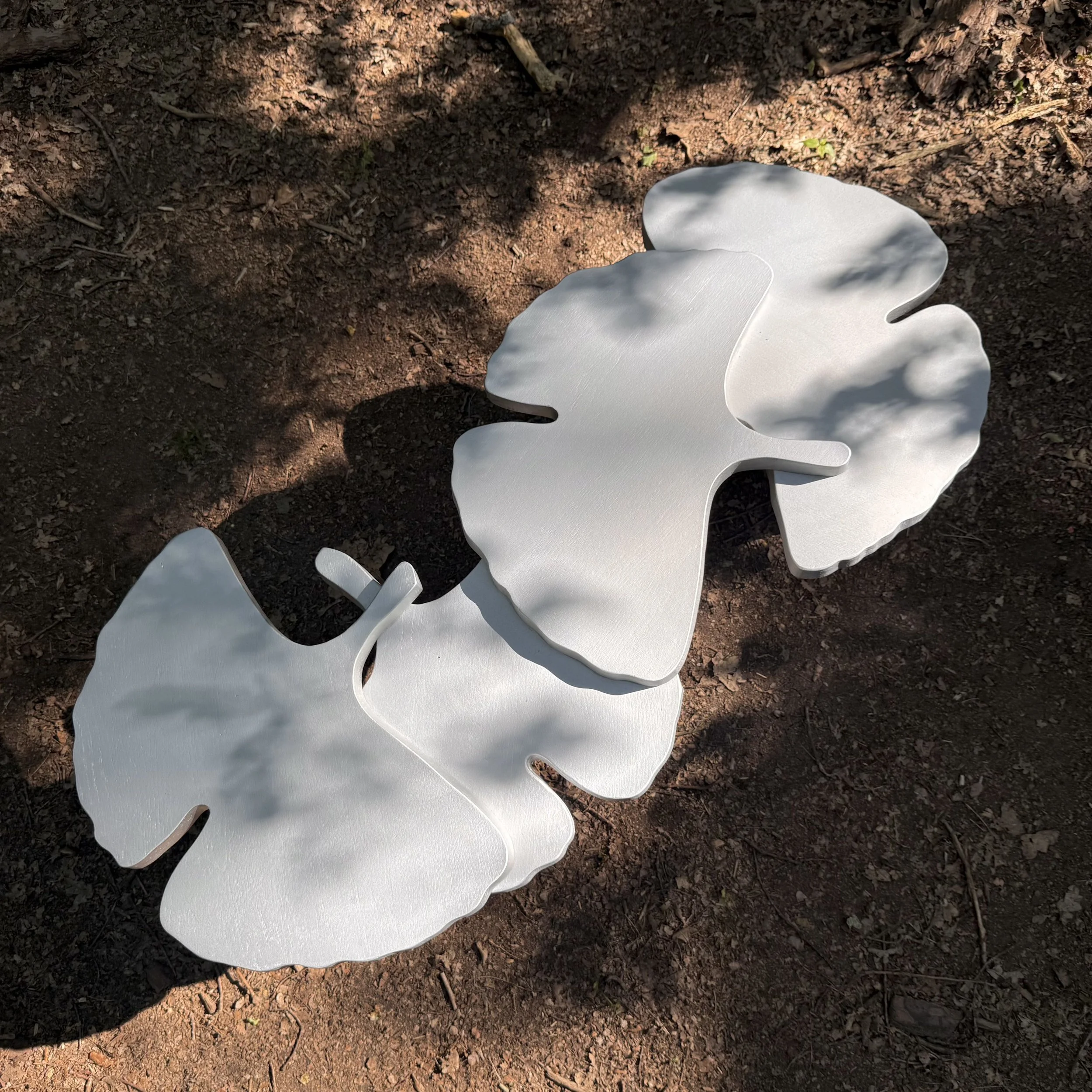 Sculptural solid oak coffee table by KHARAD STUDIO inspired by natural organic forms.