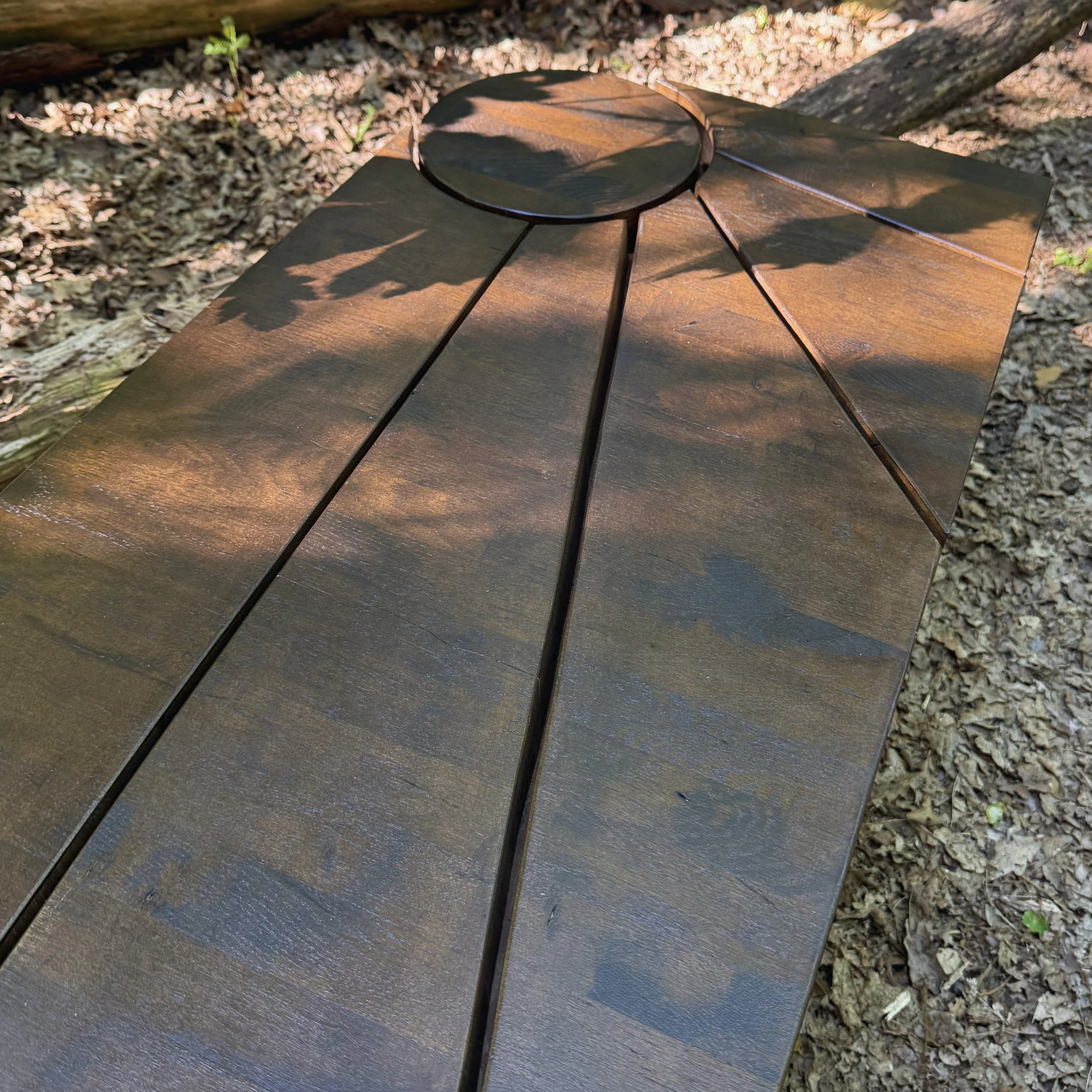 Sculptural solid oak coffee table by KHARAD STUDIO featuring a circular design inspired by nature.
