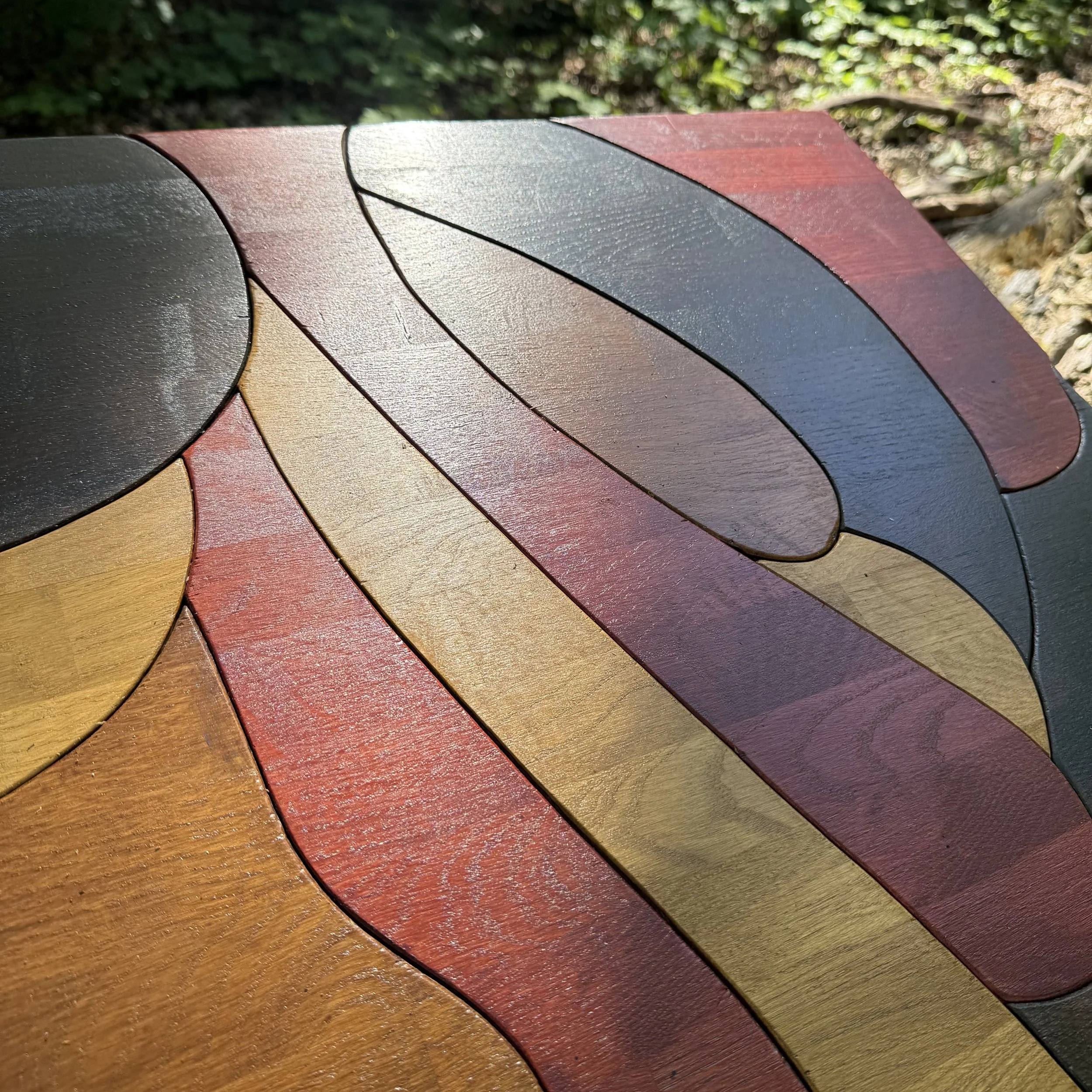 Close-up of the handcrafted sculptural surface of a KHARAD STUDIO solid oak coffee table.