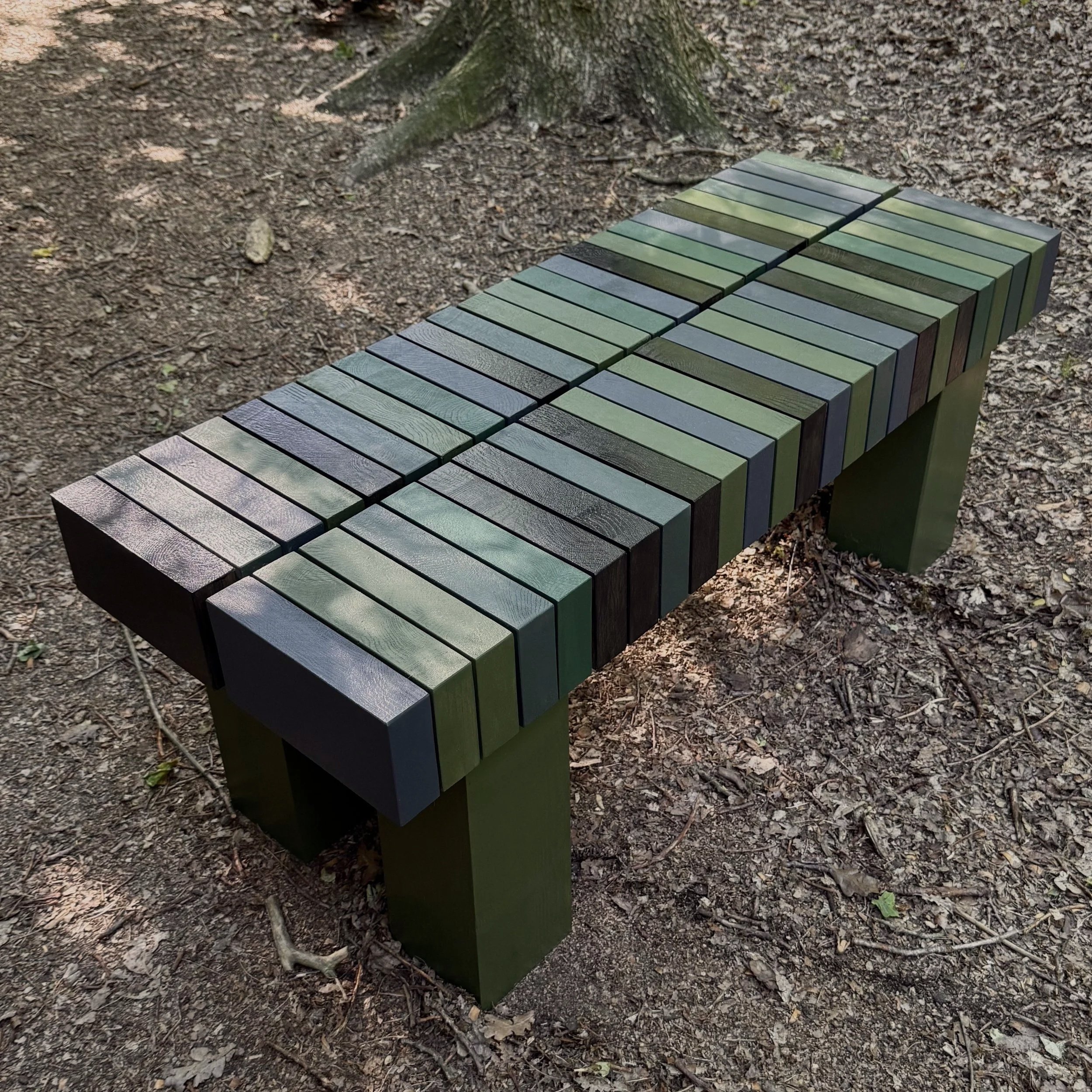 Designer solid oak coffee table with sculptural surface by KHARAD STUDIO.