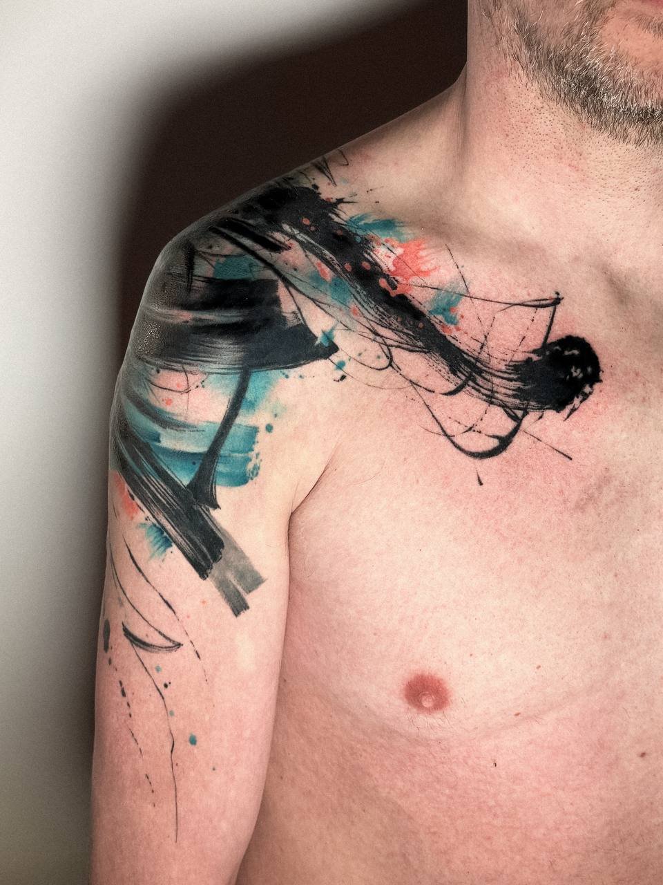 Abstract color tattoo with bold shapes and painterly details by Maya Marina Tattoo.