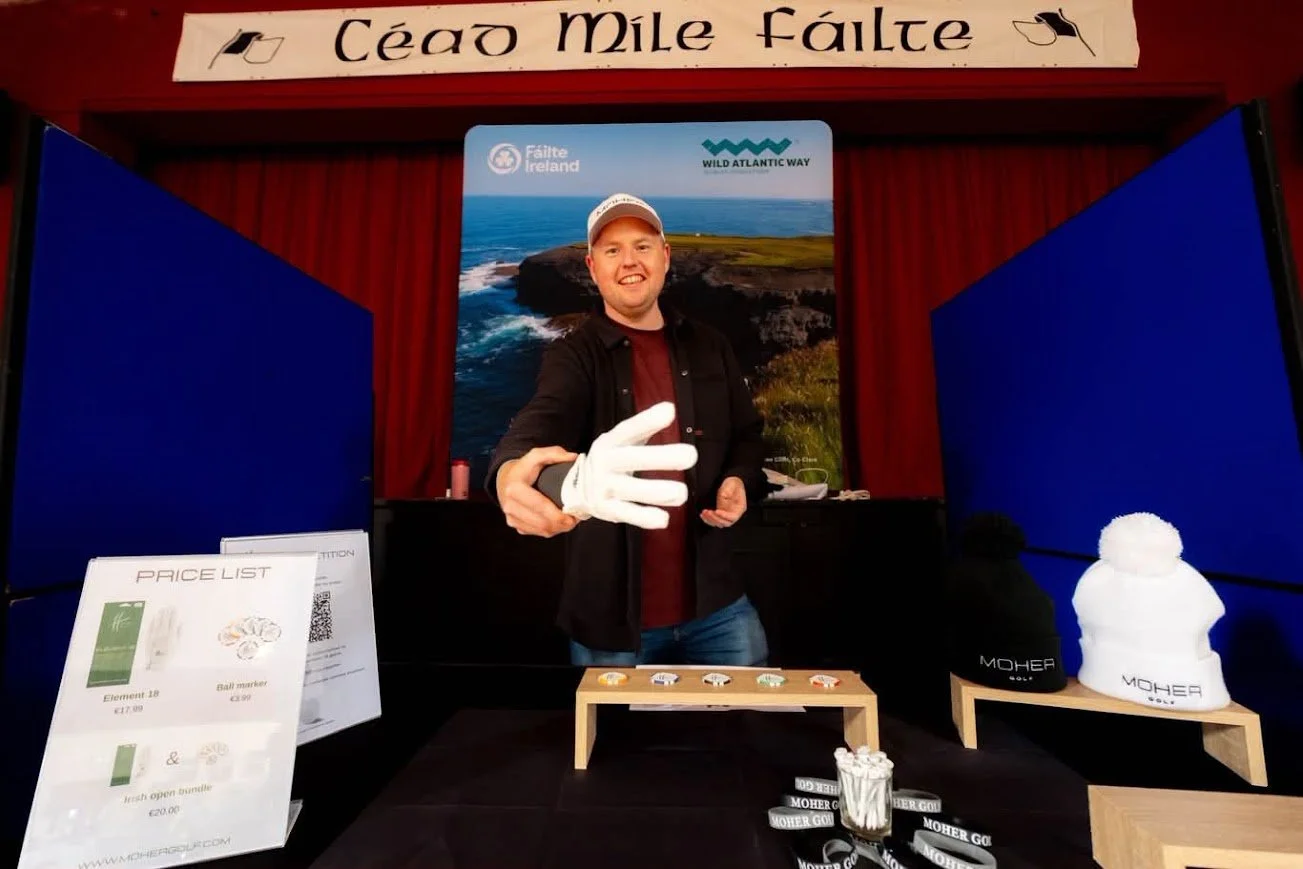 Moher Golf founder showcasing the Element 18 all-weather golf glove at a club demo and fitting display in Ireland.