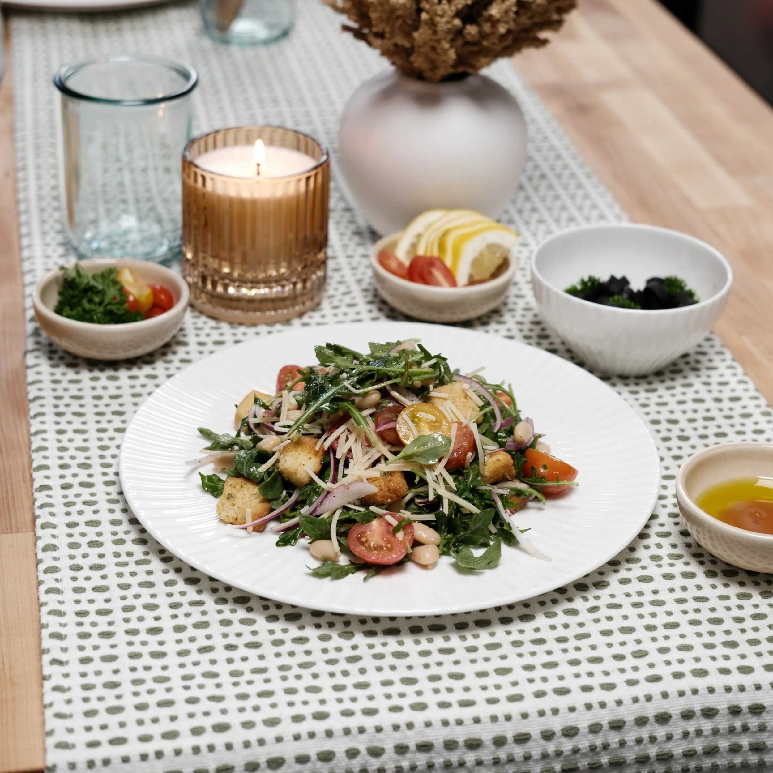 Pita & Maíz panzanella salad with arugula, tomatoes, red onion and toasted bread.
