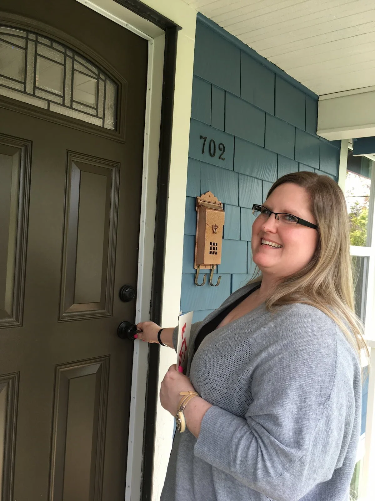Homeowner opening door to house for the first time.