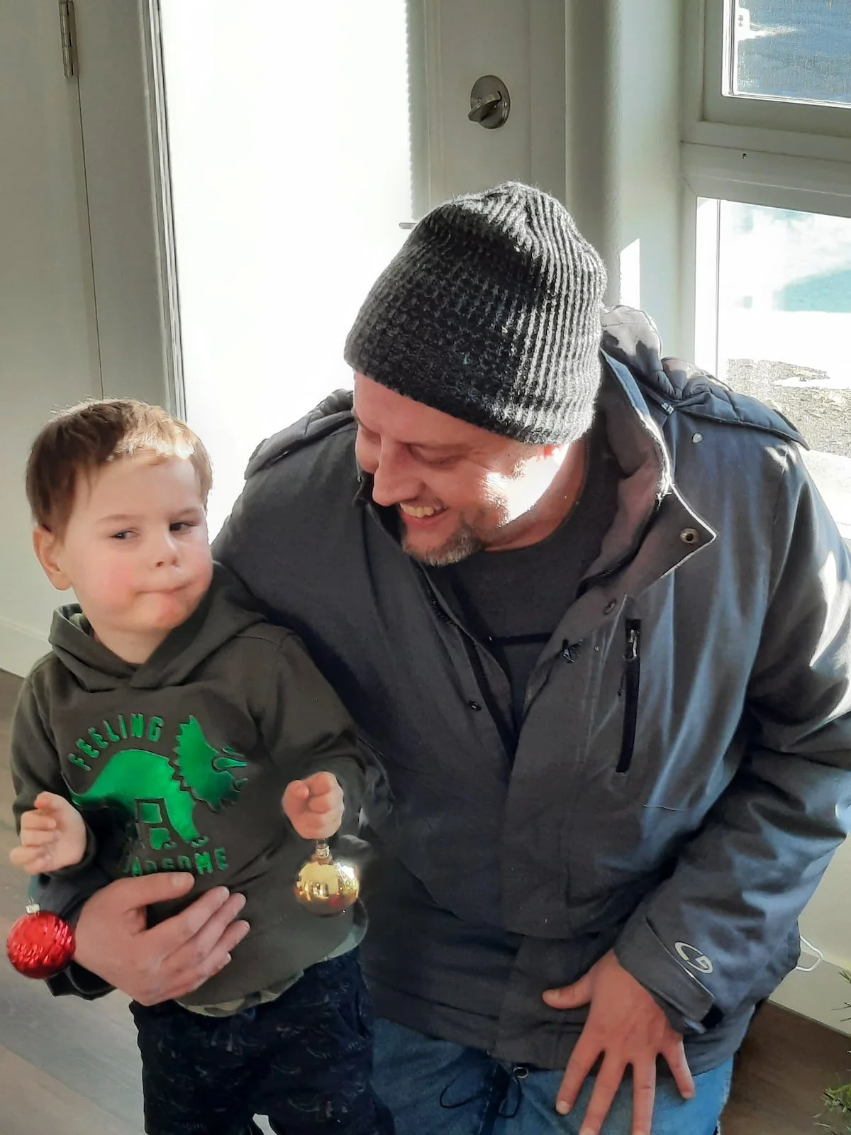 Father with son at Community Frameworks property