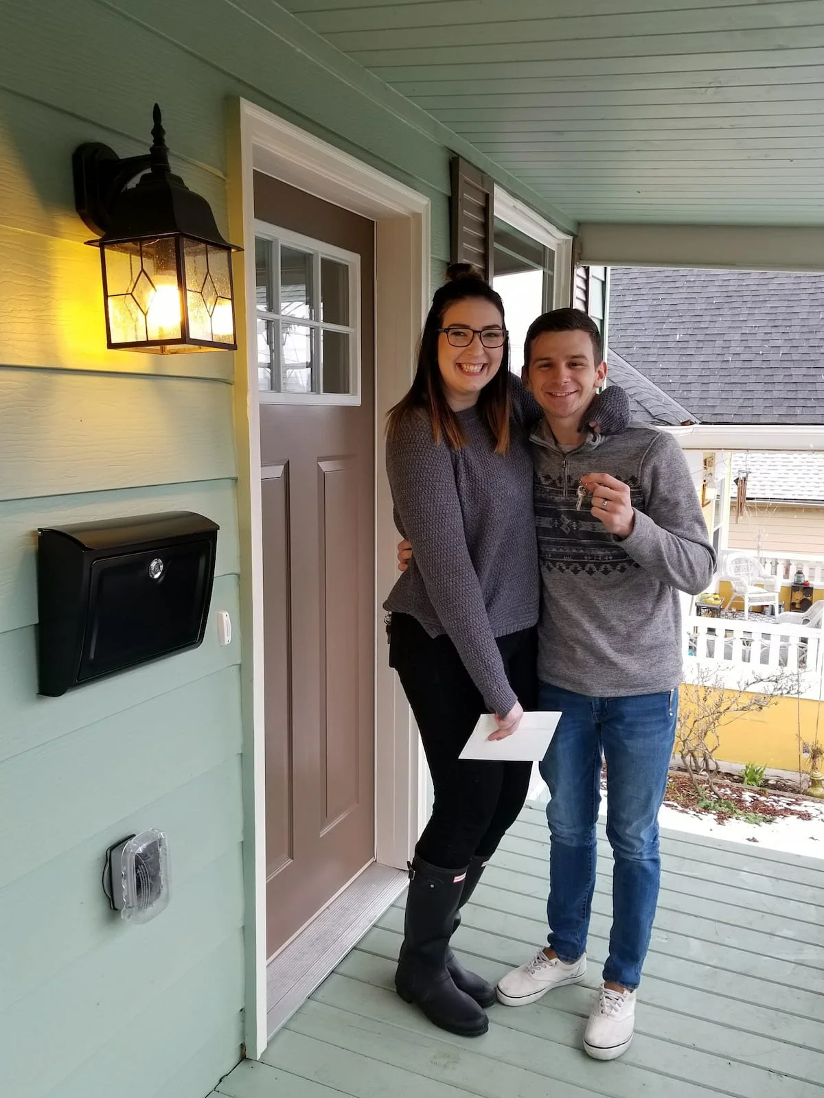 Homeowners getting the keys to their new home.