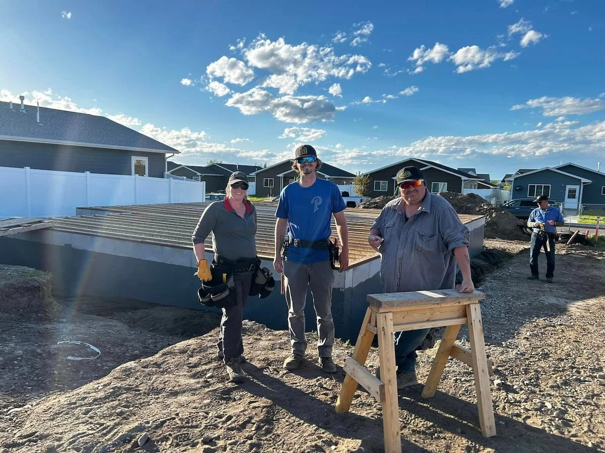 Builders working on affordable housing project.
