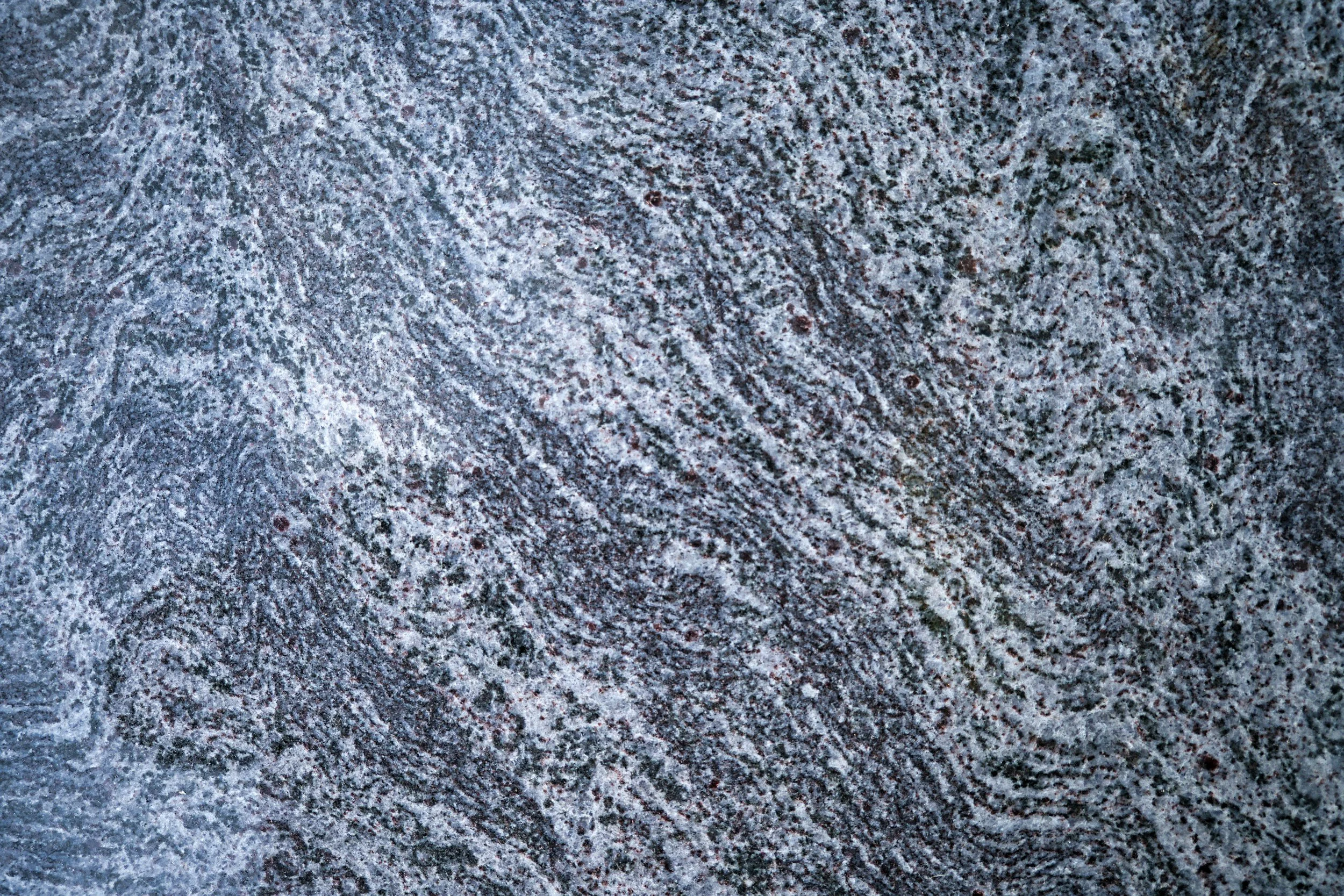 Close-up photograph of a speckled granite surface.